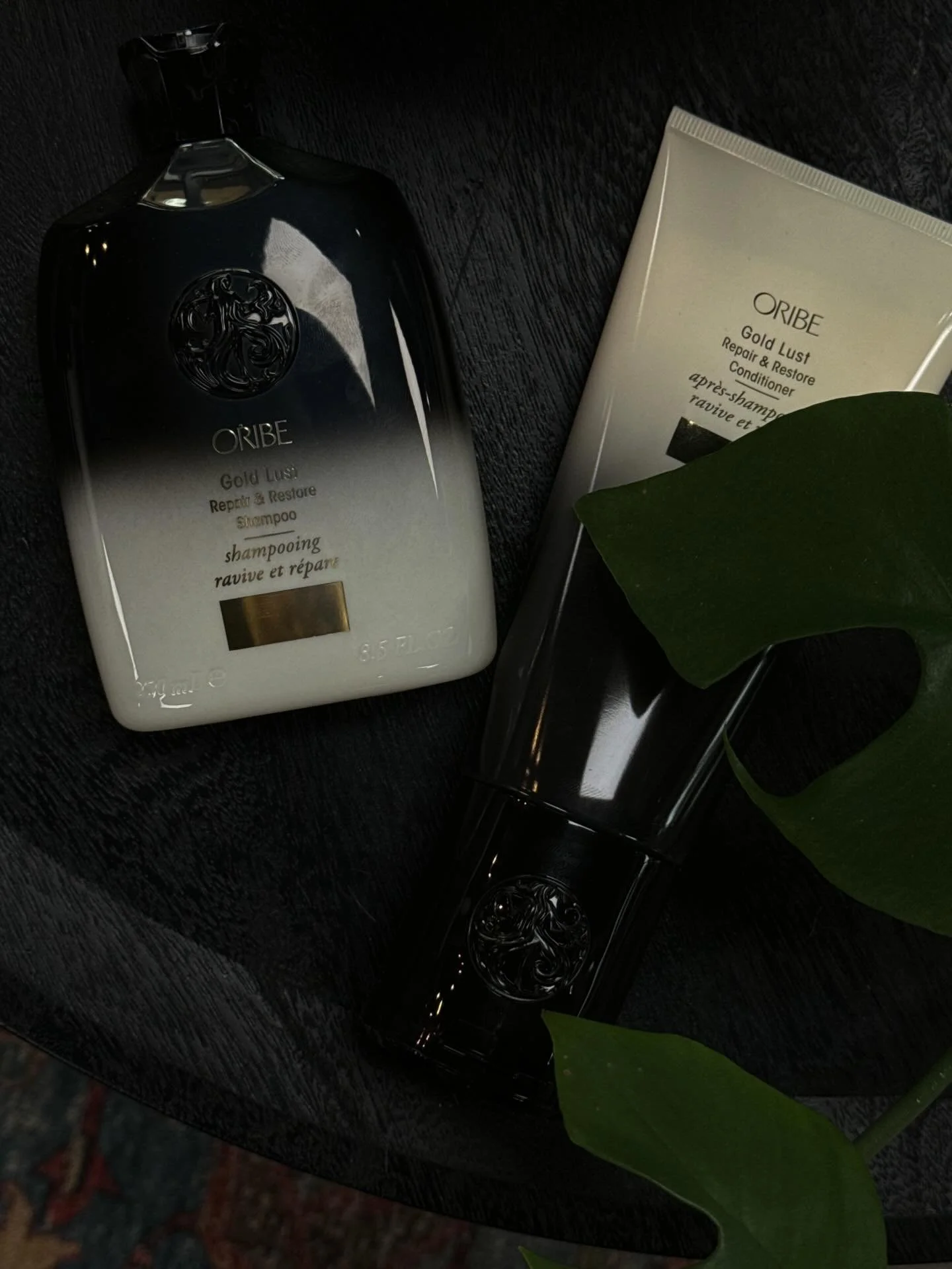 ORIBE Gold Lust Repair &amp; Restore Shampoo and Conditioner✨🖤

Shampoo:
-Reinforces the inner strength of each strand
-Rejuvenates hair so it appears more youthful and healthy
-Gently cleanses hair
-Restores moisture
-Protects hair from damage

Con