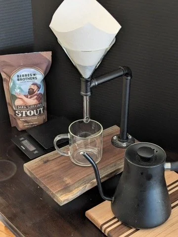 Wooden cutting board with stand on marble surface