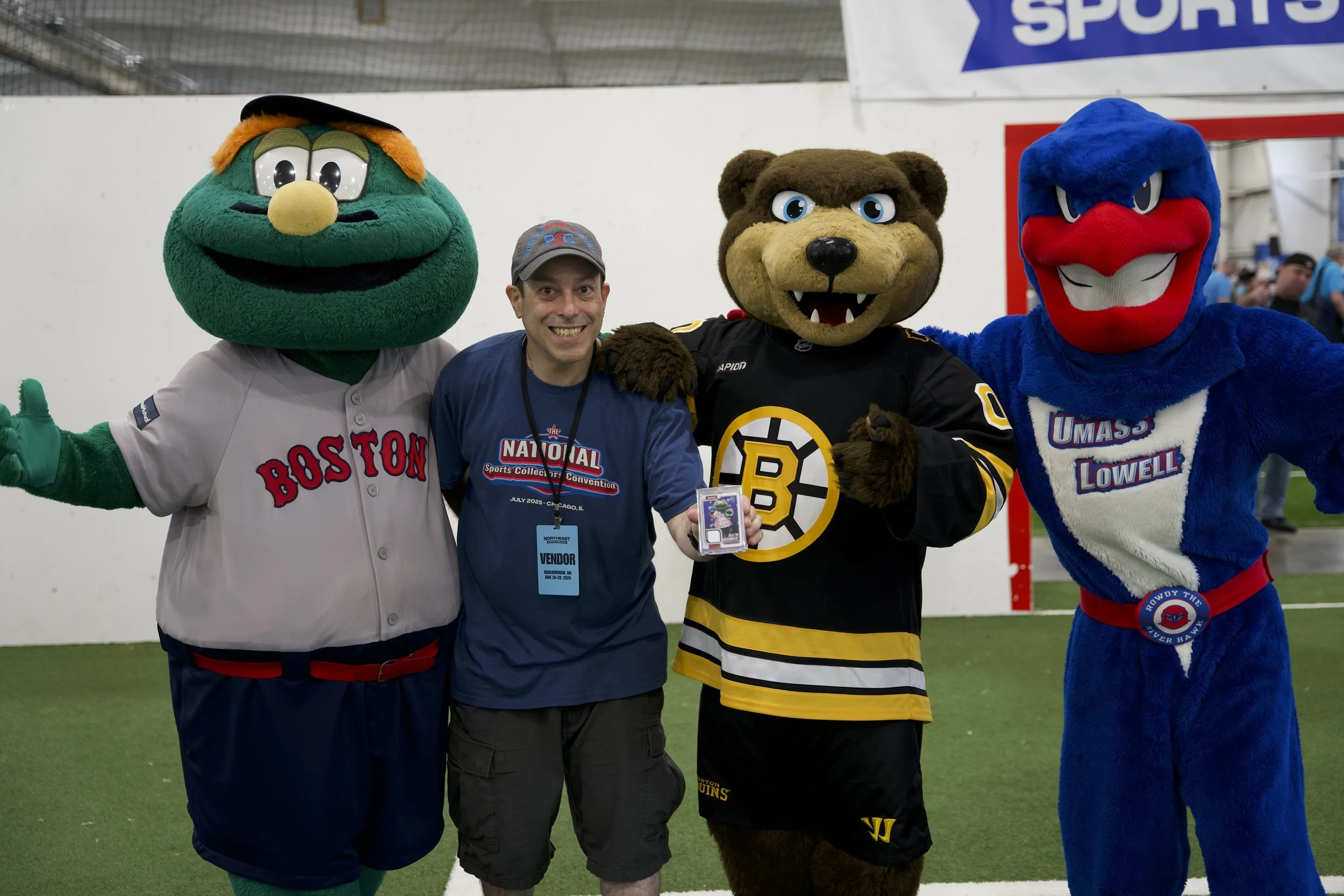 A vendor with mascots Wally, Blades and Rowdy