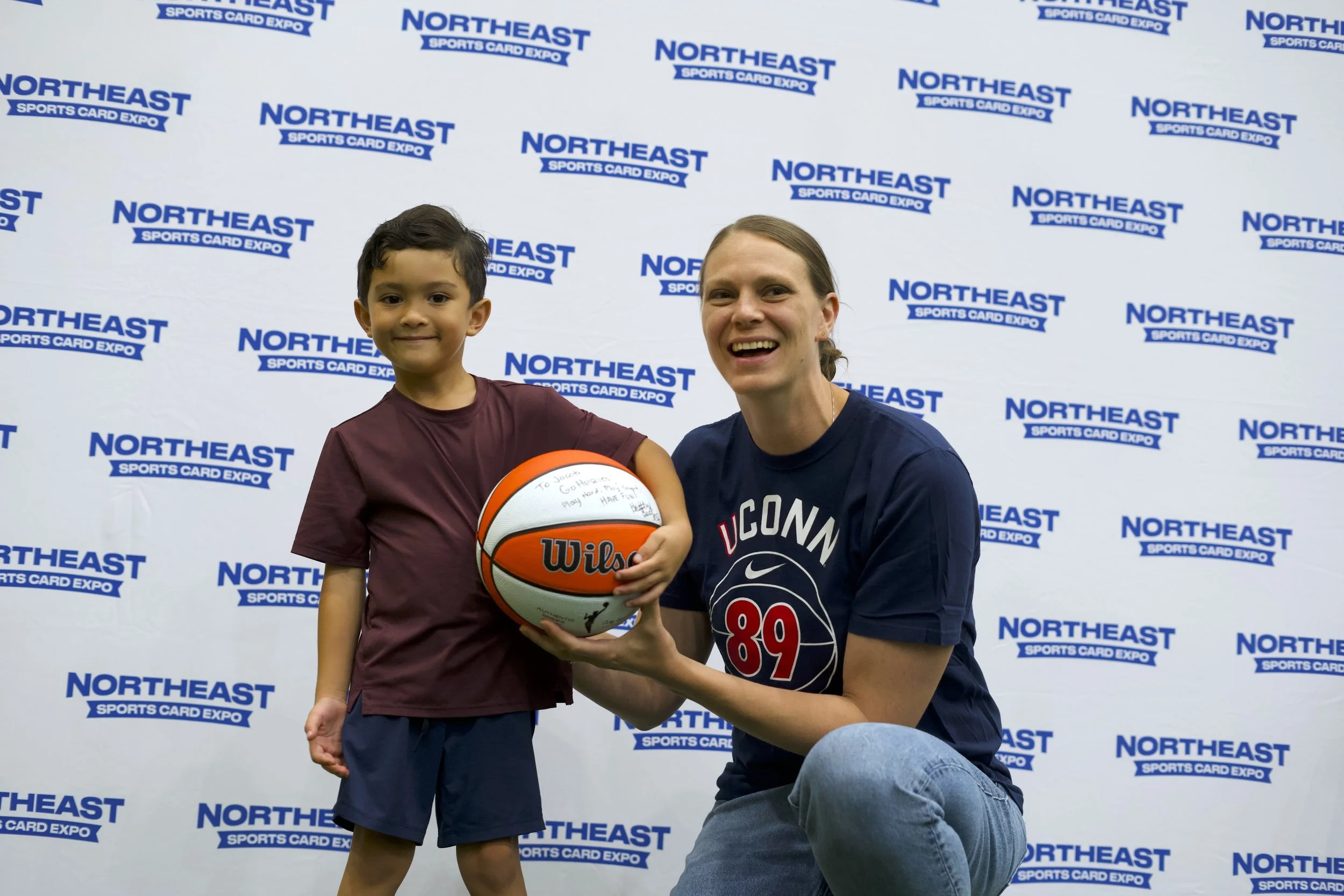 UConn legend Heather Buck with a raffle prize winner