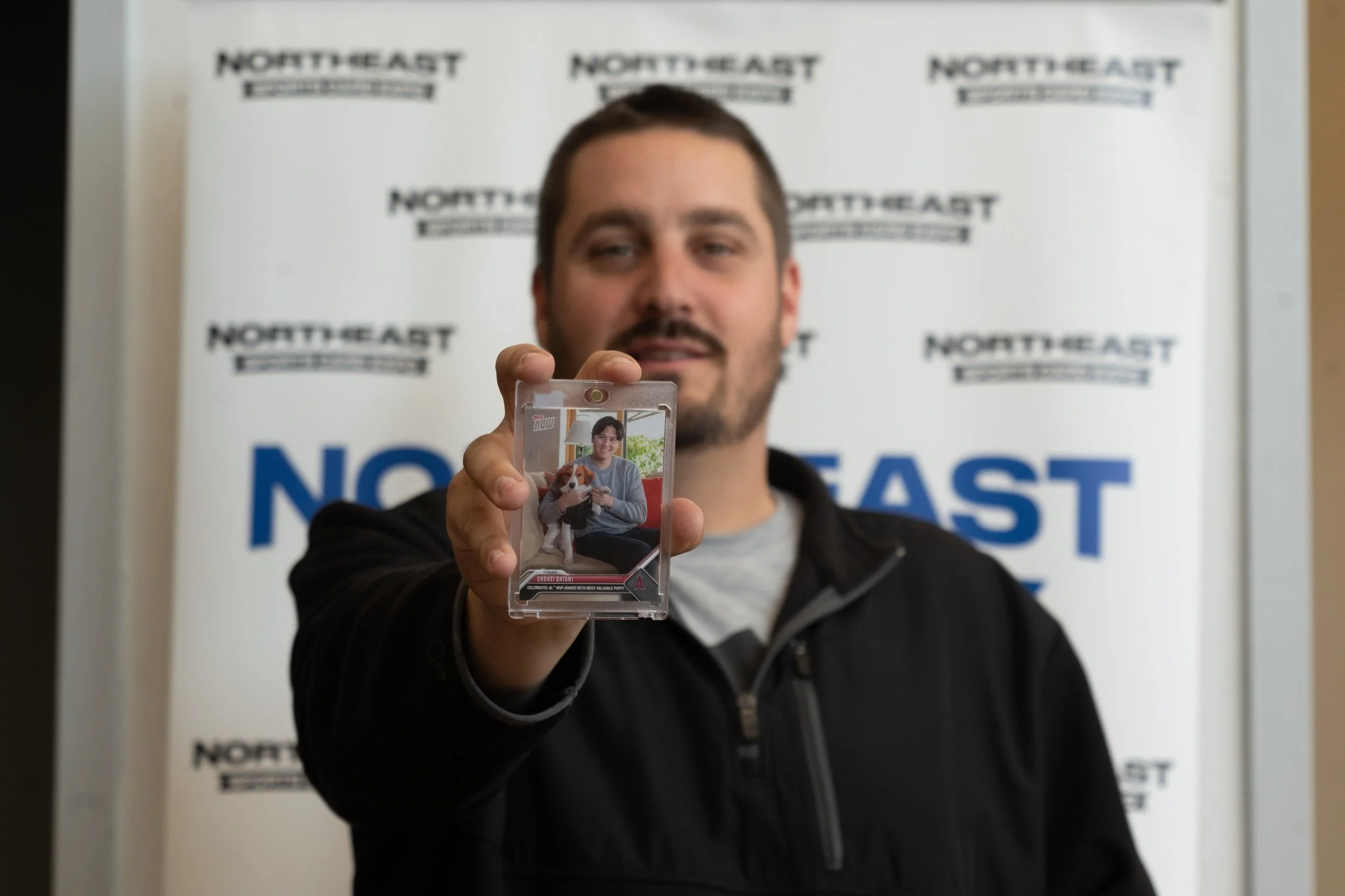 Event Host Taylor Mannix shows off his recent purchase at the show