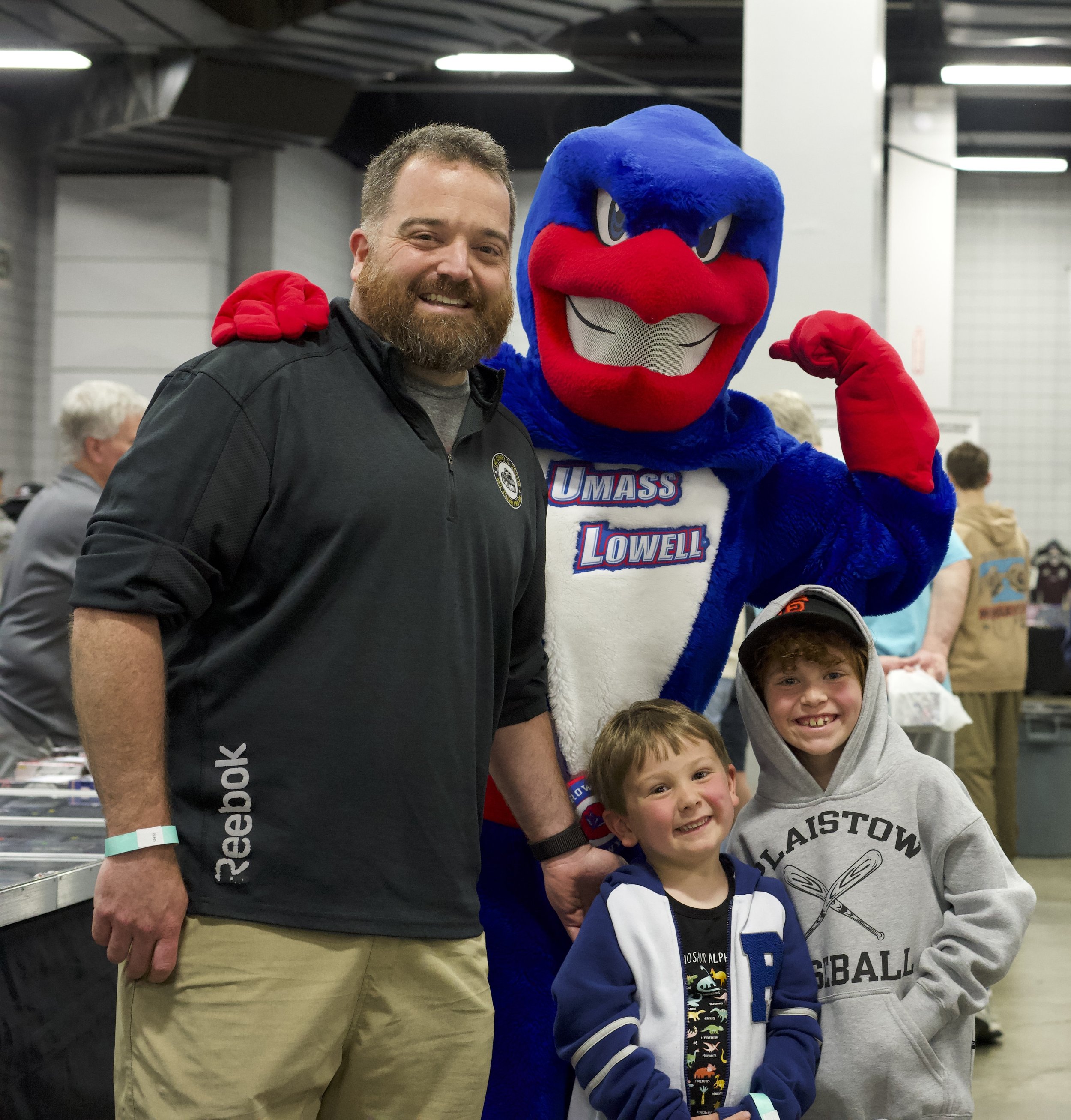 Attendees at the Northeast Sports Card Expo: Marlborough with UMass Lowell mascot Rowdy the Riverhawk.