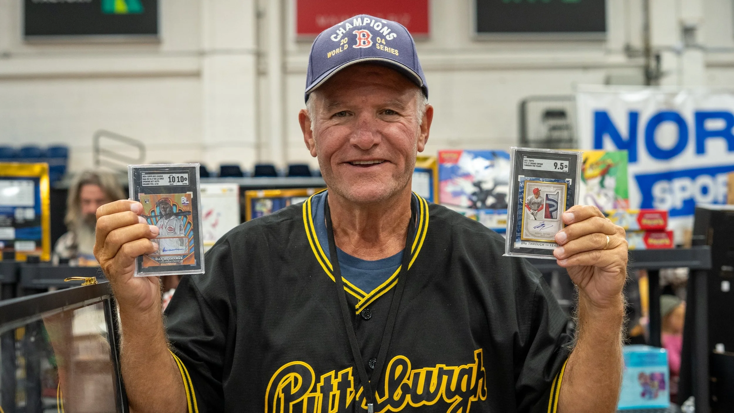 A fan shows off his cards