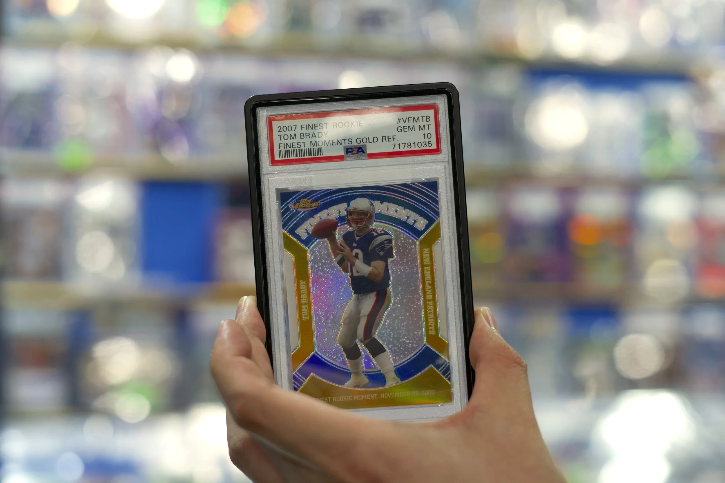 An attendee at the Northeast Sports Card Expo in Stamford, Connecticut shows off their prized card