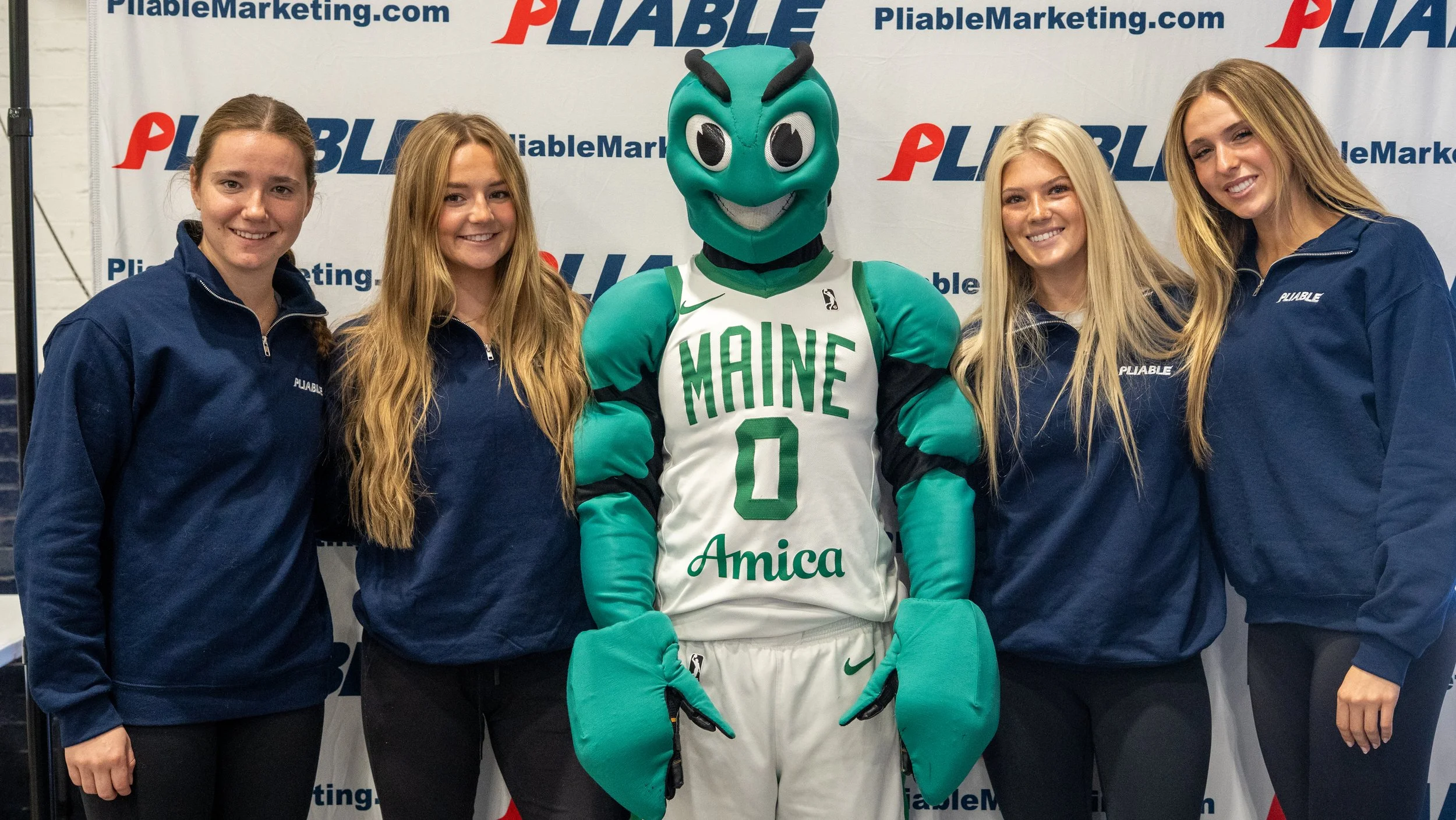 Maine Celtics mascot Crusher with athletes from Pliable Marketing