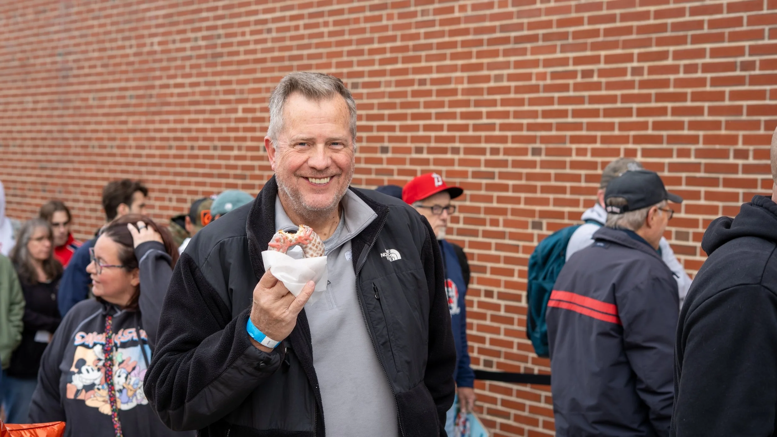 An attendee at the Northeast Sports Card Expo: Maine with the Northeast All-Star specialty donut from The Holy Donut