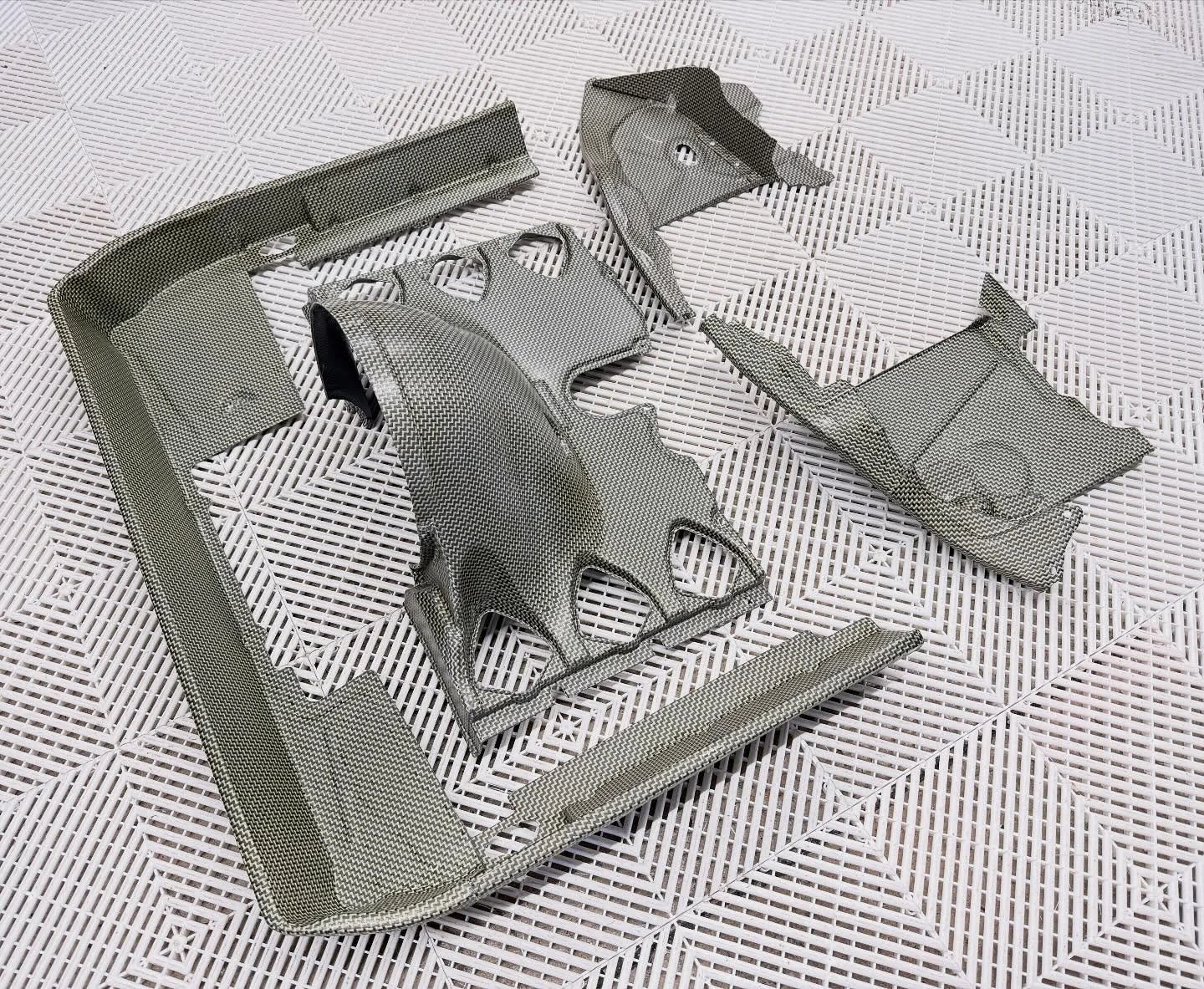 Carbon/Kevlar 964 fan shroud with integrated heater delete and tinware with PS delete. Also available in just carbon fibre.