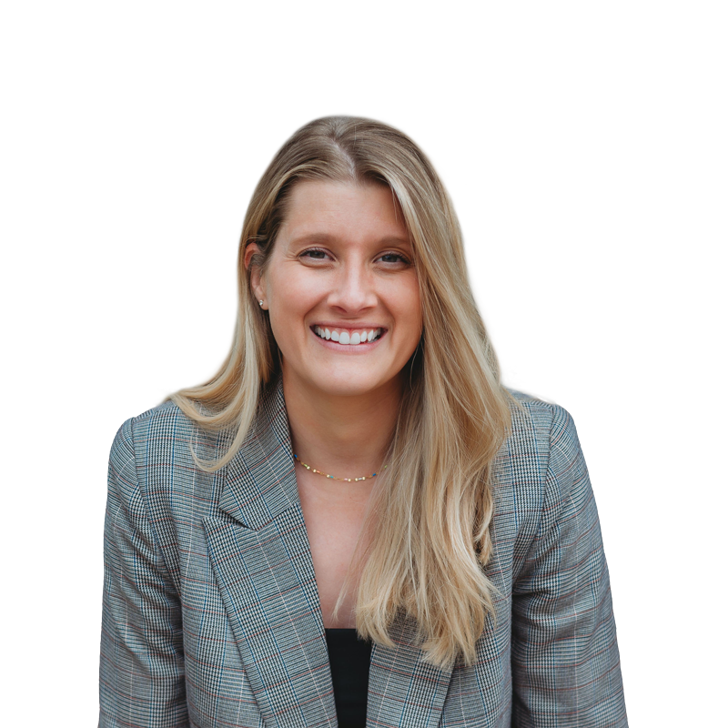 Carley Rollins, creator of The Nuanced Nutritionist newsletter, smiling in a plaid blazer.