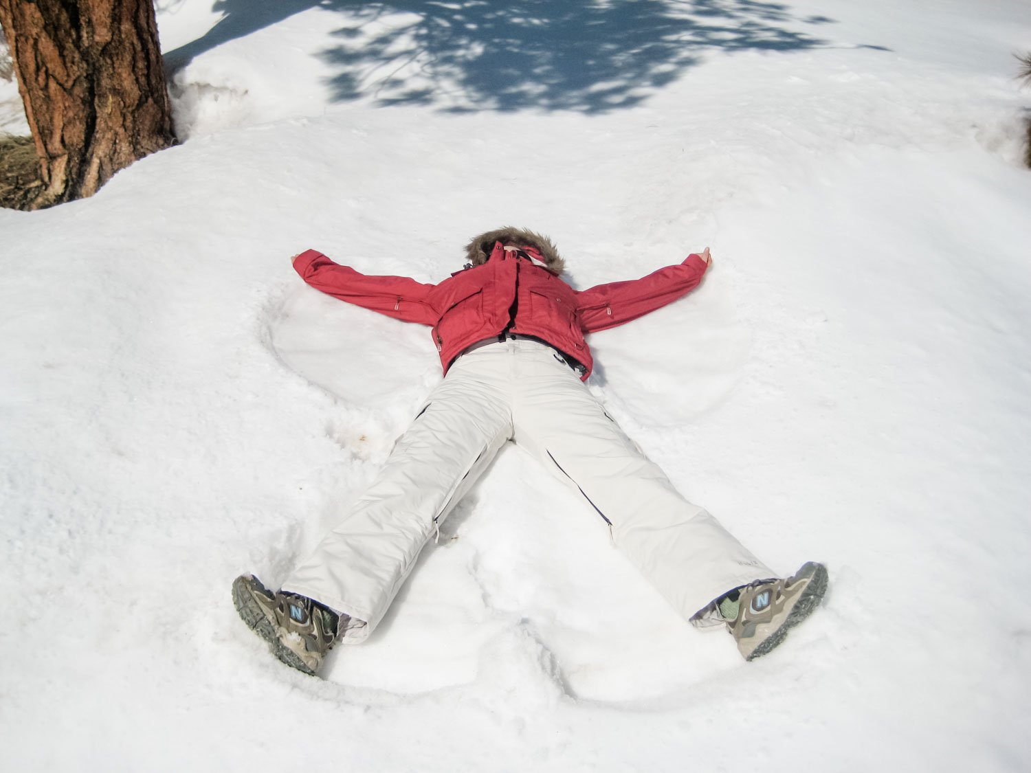woman making snow angel