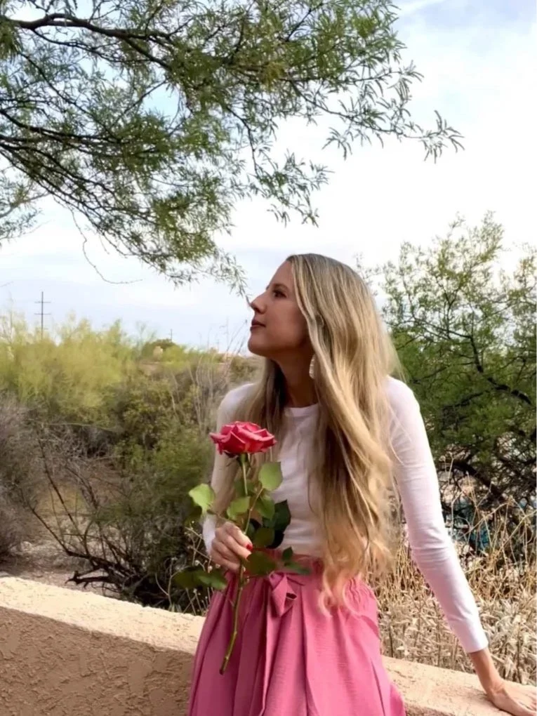 woman author holding a rose