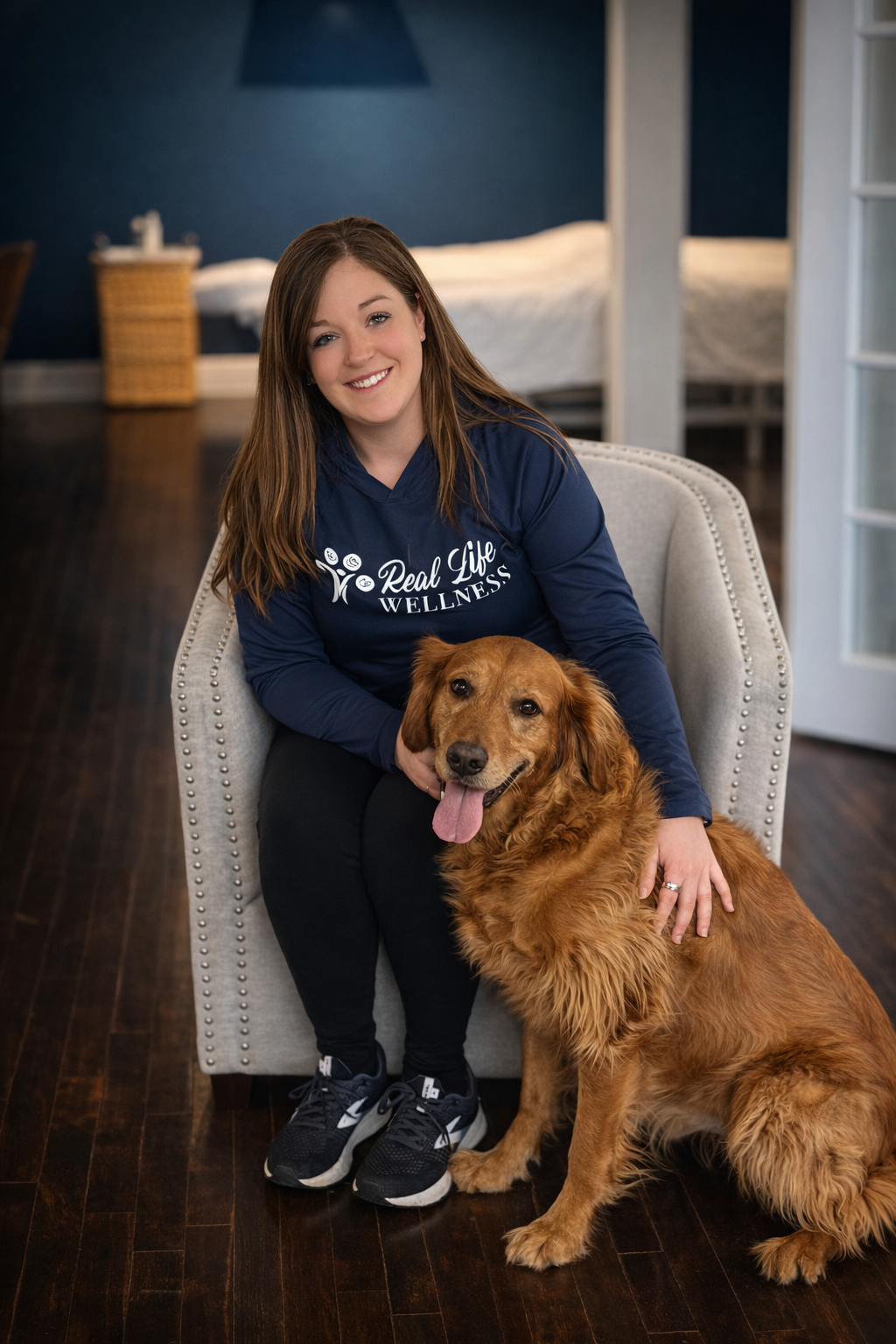 Bailey Swensen, owner of Real Life Wellness Studio and her dog, Finnigan.