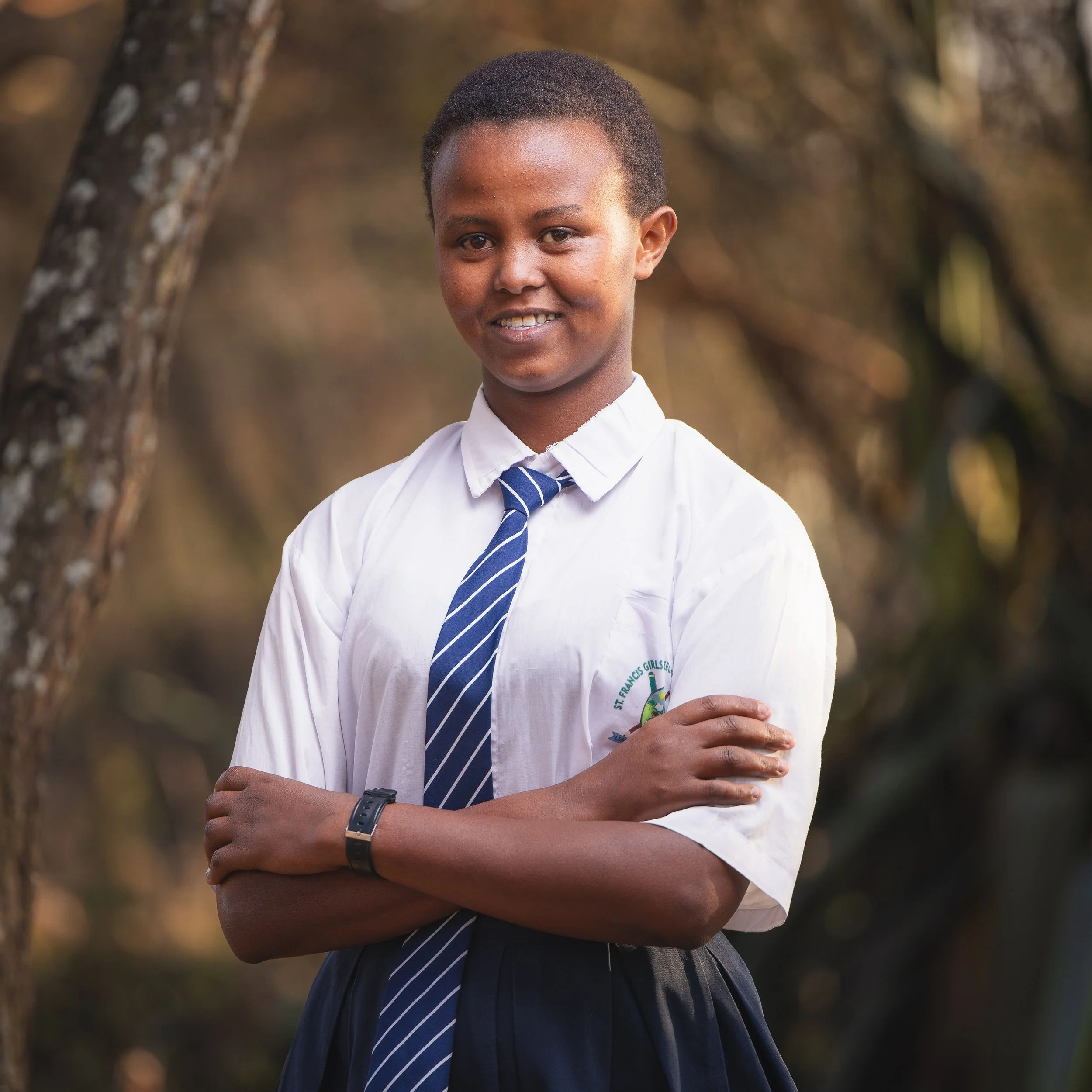 Lilian Kilwa | Lilian is in grade 11 at St Francis. She hopes to maintain good grades in order to become a nurse and help her community. At 17 years old, she describes herself as hardworking and enthusiastic. Lilian is being raised by a single parent