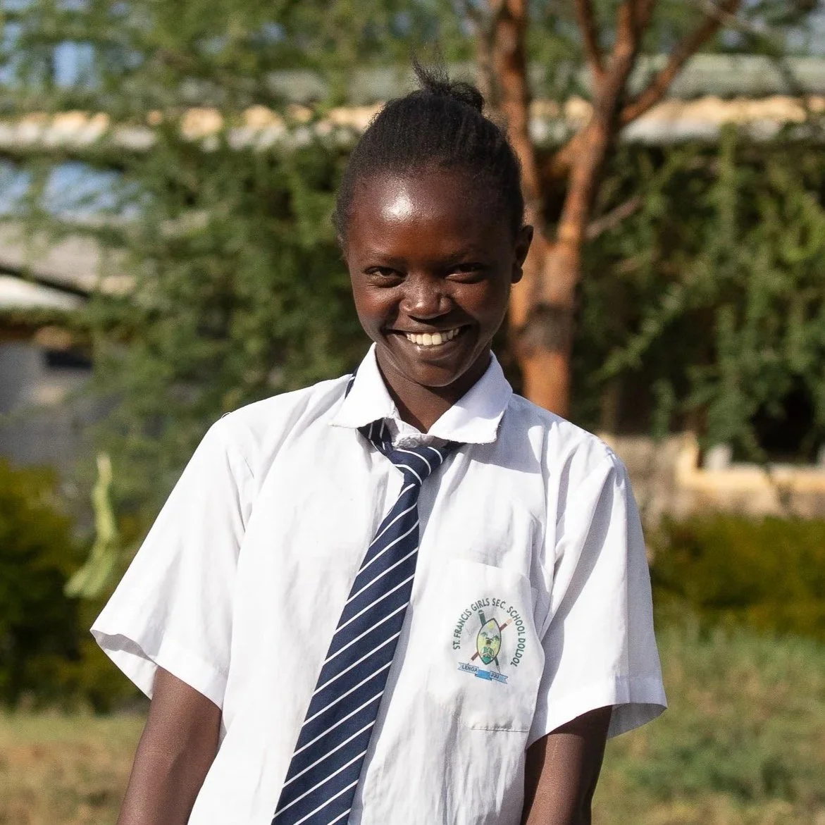 Blessing Nashipae | Blessing hopes to work as a nurse in her community. At 16, she describes herself as hardworking and helpful, loves playing soccer and running. Blessing’s energetic character makes a positive impact in both class and extra-curricul