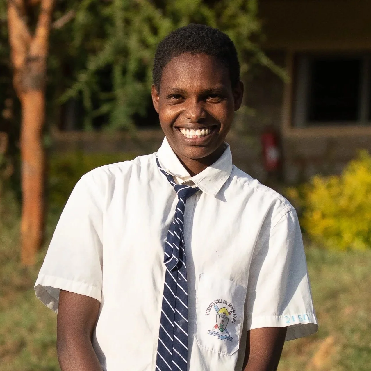 Josephine Meshami | Josephine is 17 years old, a junior in high school, and enjoys studying history. She is raised by a single parent and with several children to support, educational costs are out of reach for her family. Josephine loves music. Sh