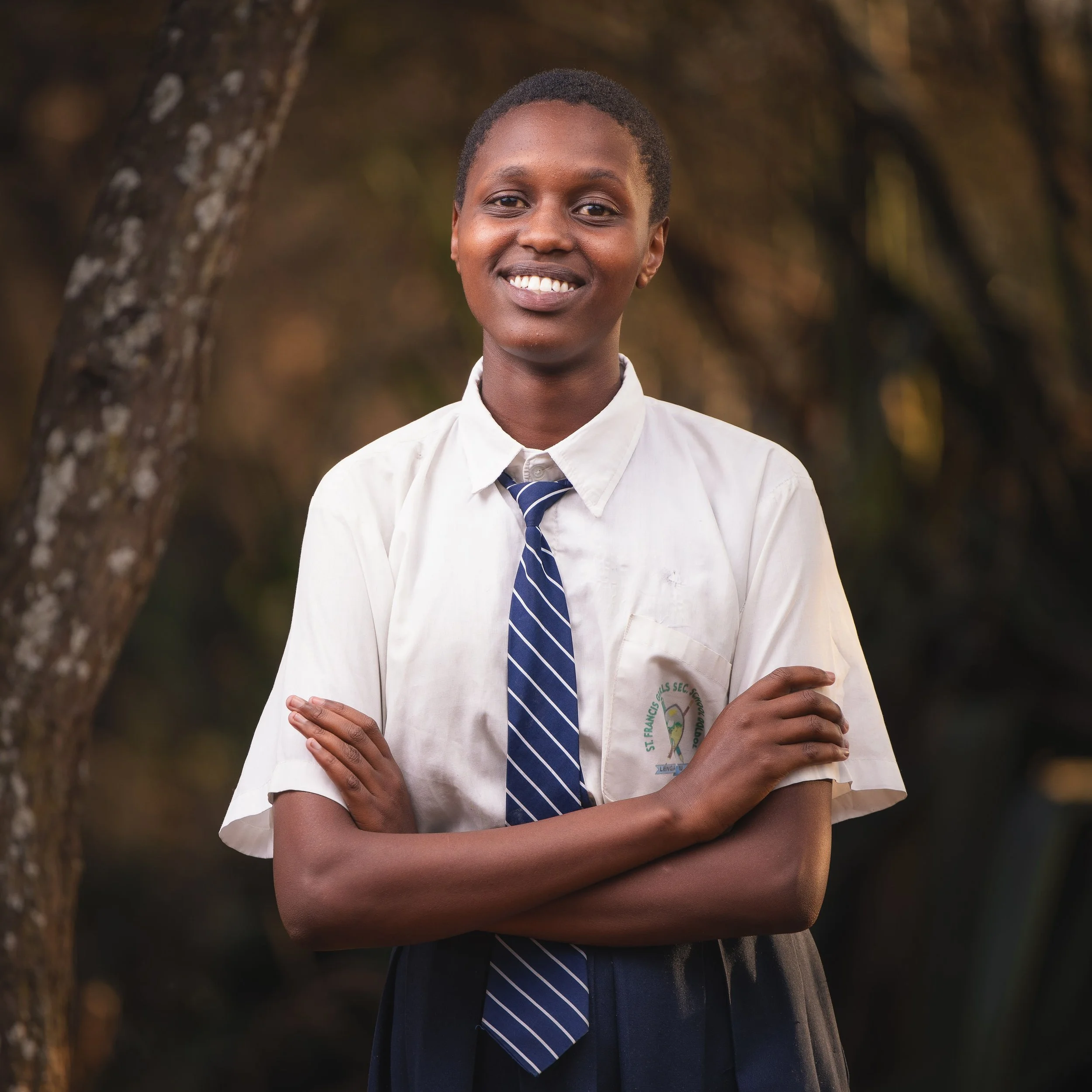 Brenda Nalesiai | Brenda is 17 years old and enjoys studying biology. She describes herself as hardworking, obedient and very self-driven. Her mother occasionally takes on small jobs, but they aren't enough to keep her in school. Brenda is one of 3 c