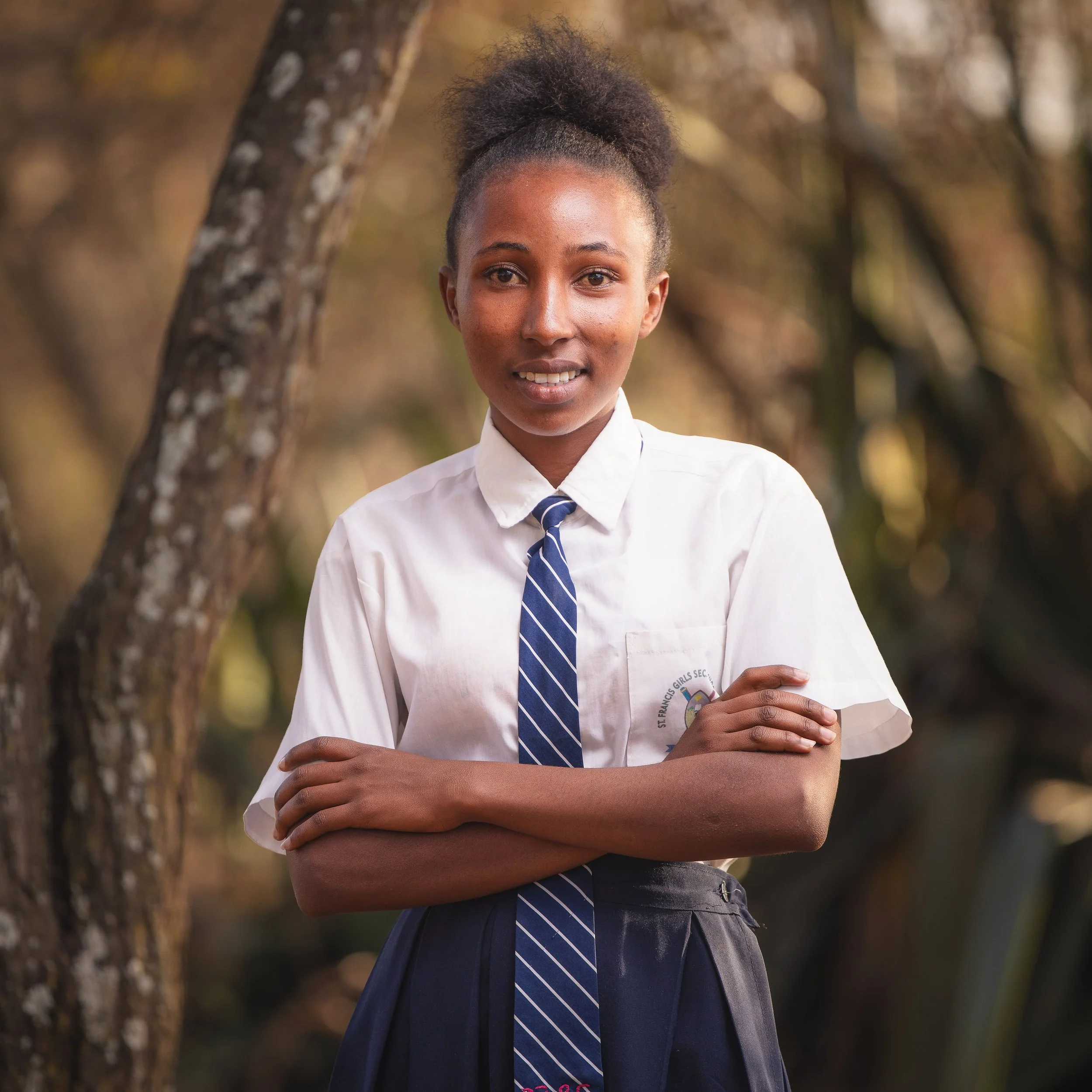 Angeline Kaparo | Angeline is 18 years old and a junior in high school. She enjoys studying home science because it’s practical and interesting. Angeline describes herself as hardworking, intelligent and obedient. She is raised by a single parent who
