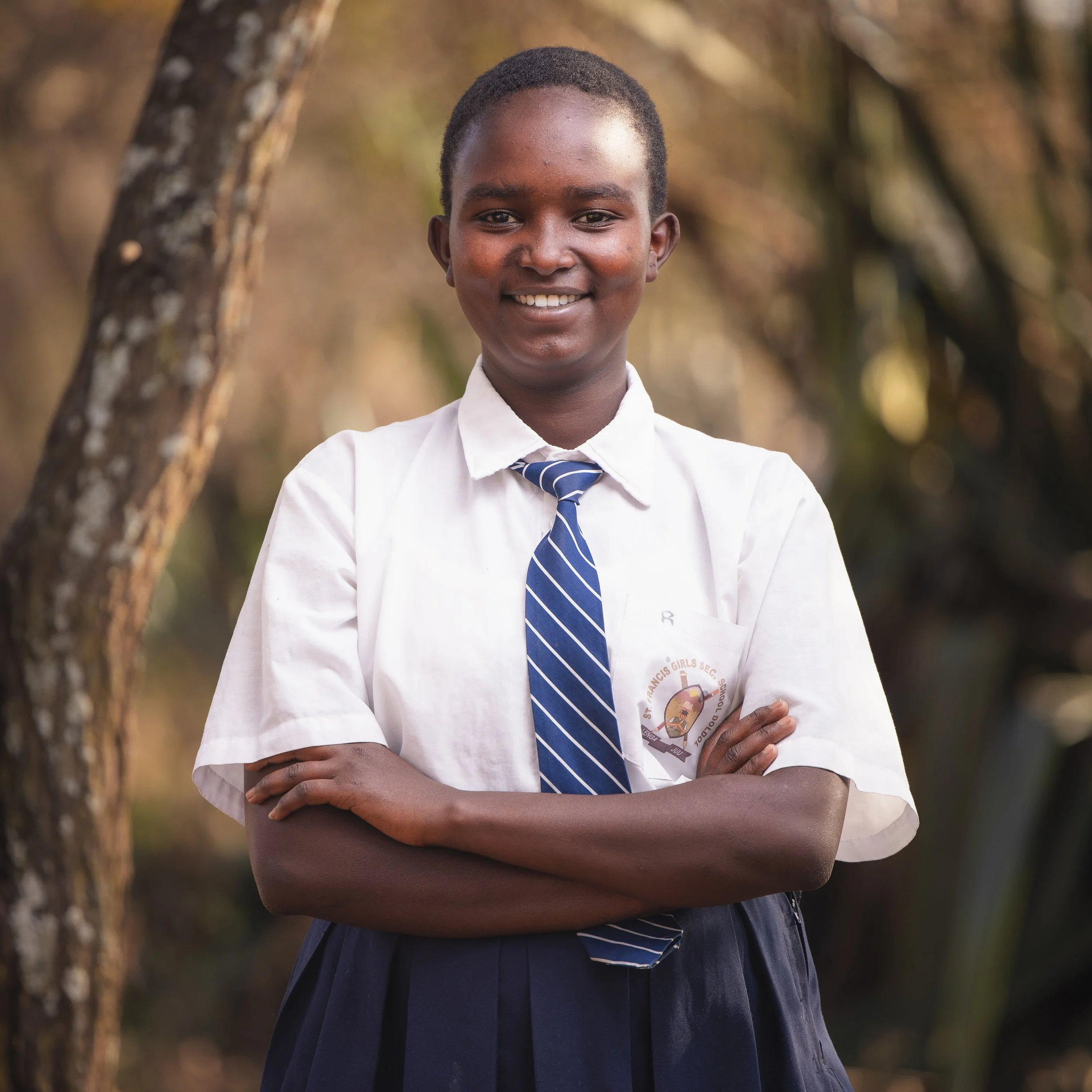 Eunice Nadupoi | Eunice is 17 years old. She is a sophomore in high school and most enjoys studying biology. Eunice wants to become a doctor to save lives and uplift those around her. Eunice’s family is large but only her mother is around, which mean