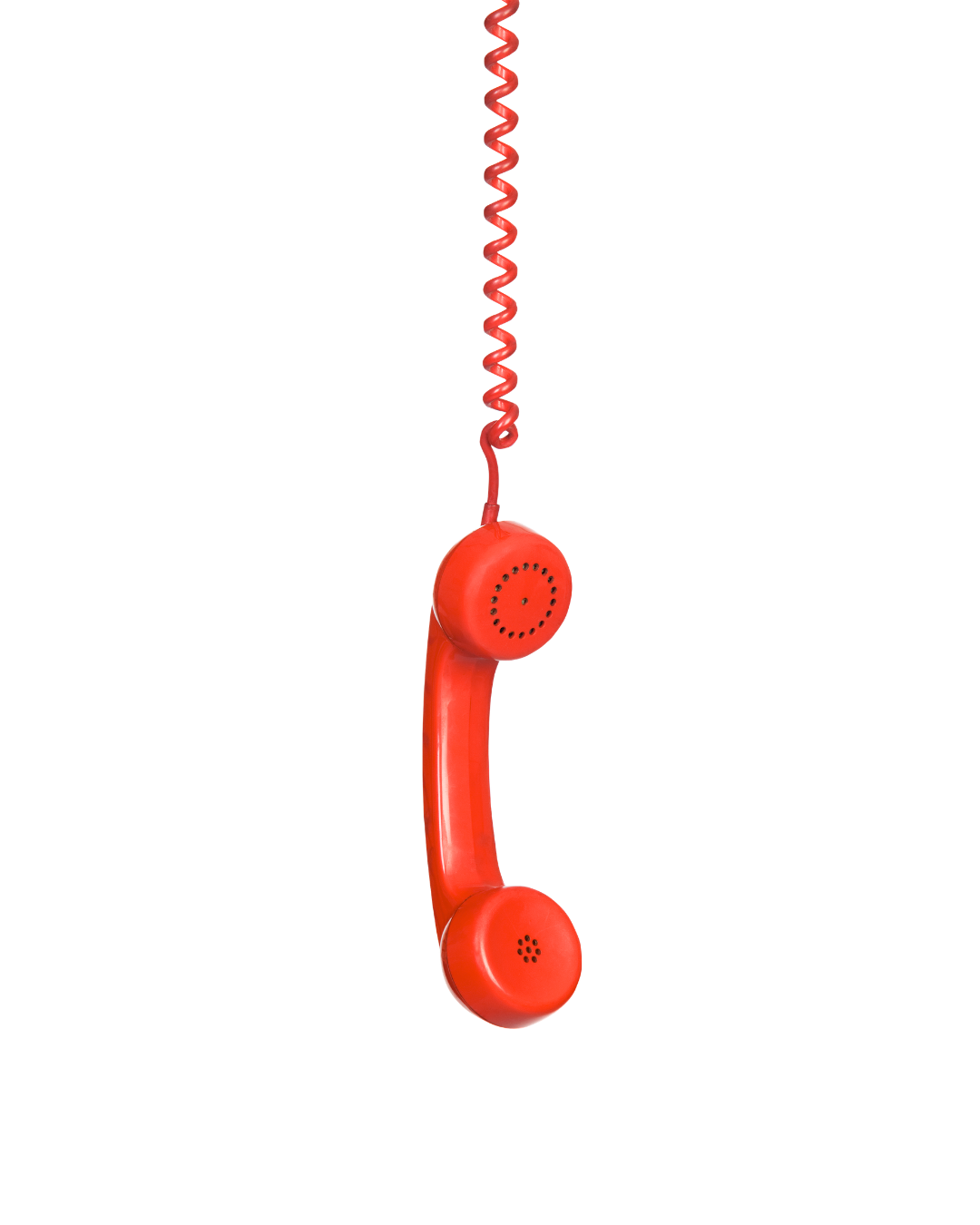 Red vintage rotary phone hanging by a coiled cord.
