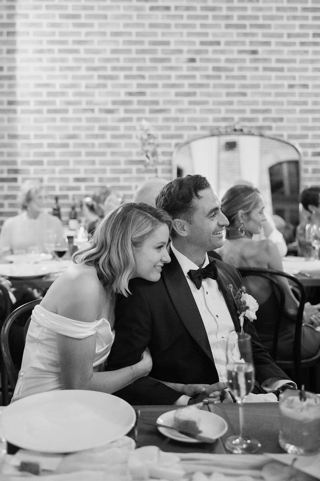 Bride and groom sharing a moment at reception 
