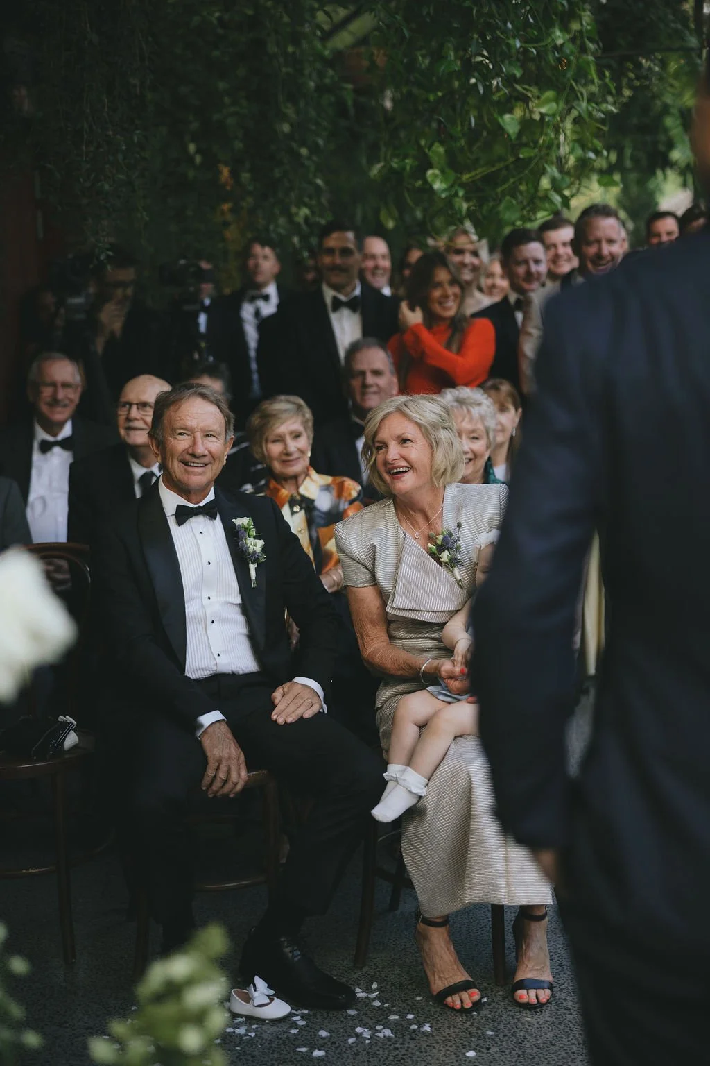 Family members reacting emotionally during the ceremony