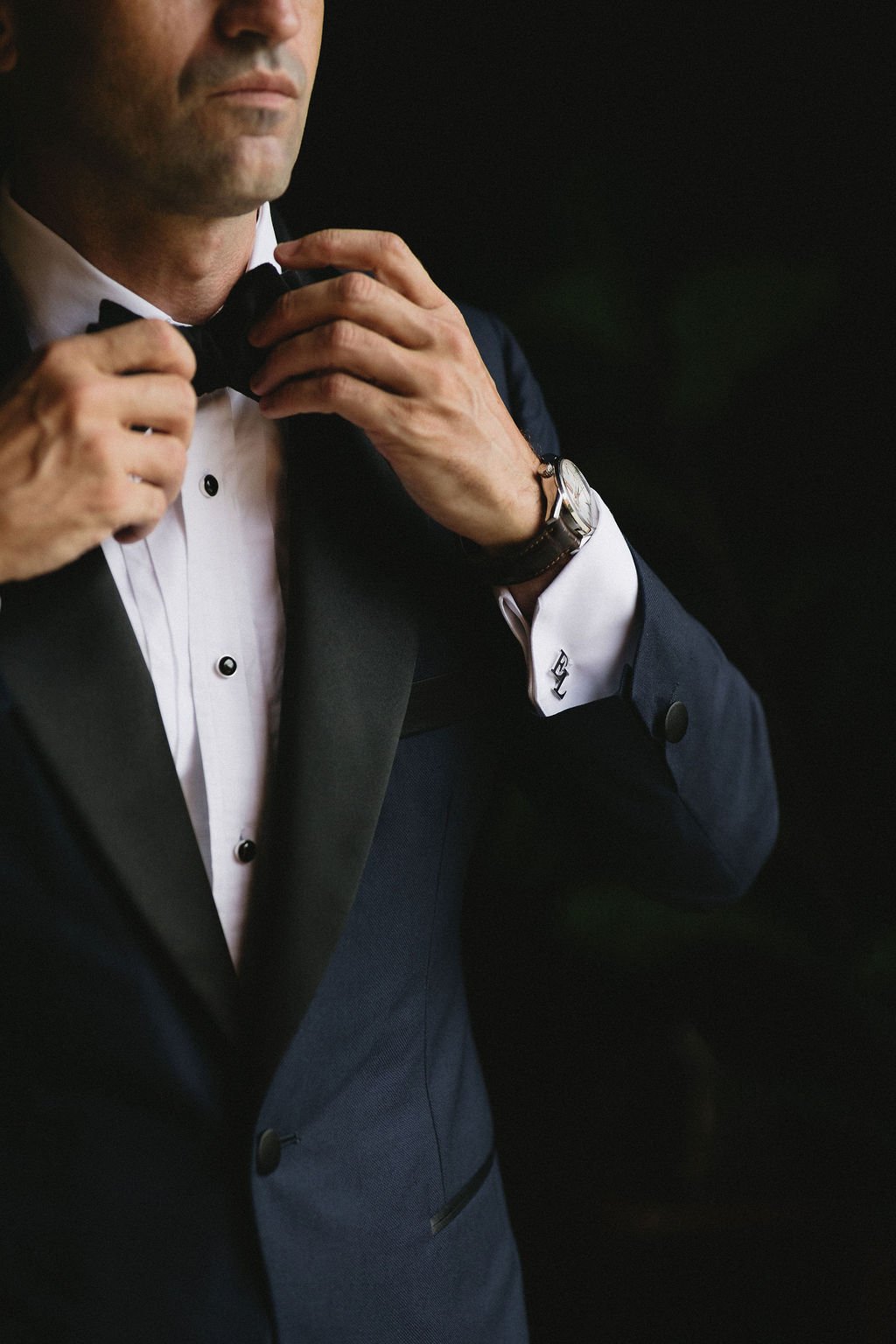Detail of groom getting ready at his wedding 