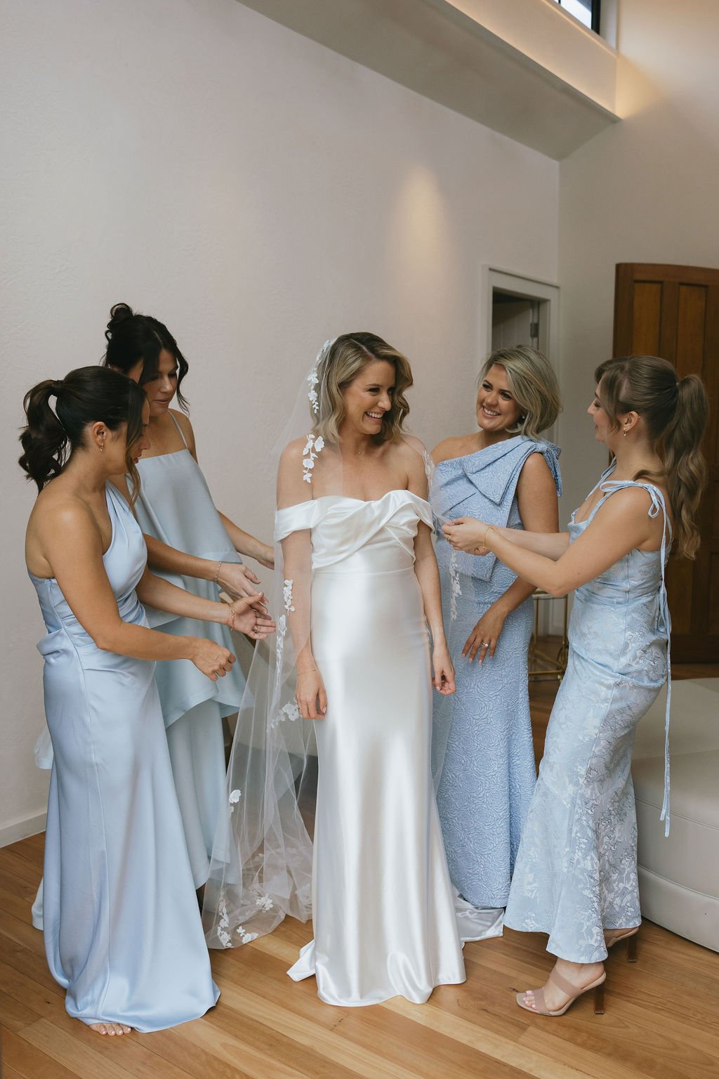 Bride putting on her wedding dress at The Valley Estate bridal suite