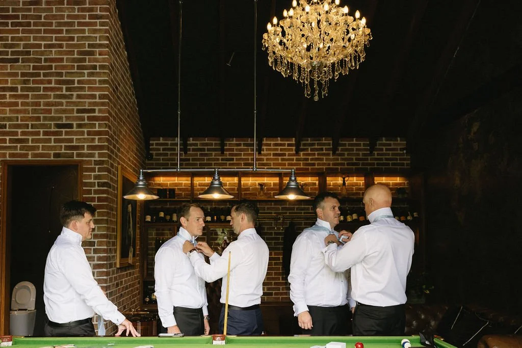 photos of the groomsmen getting ready 