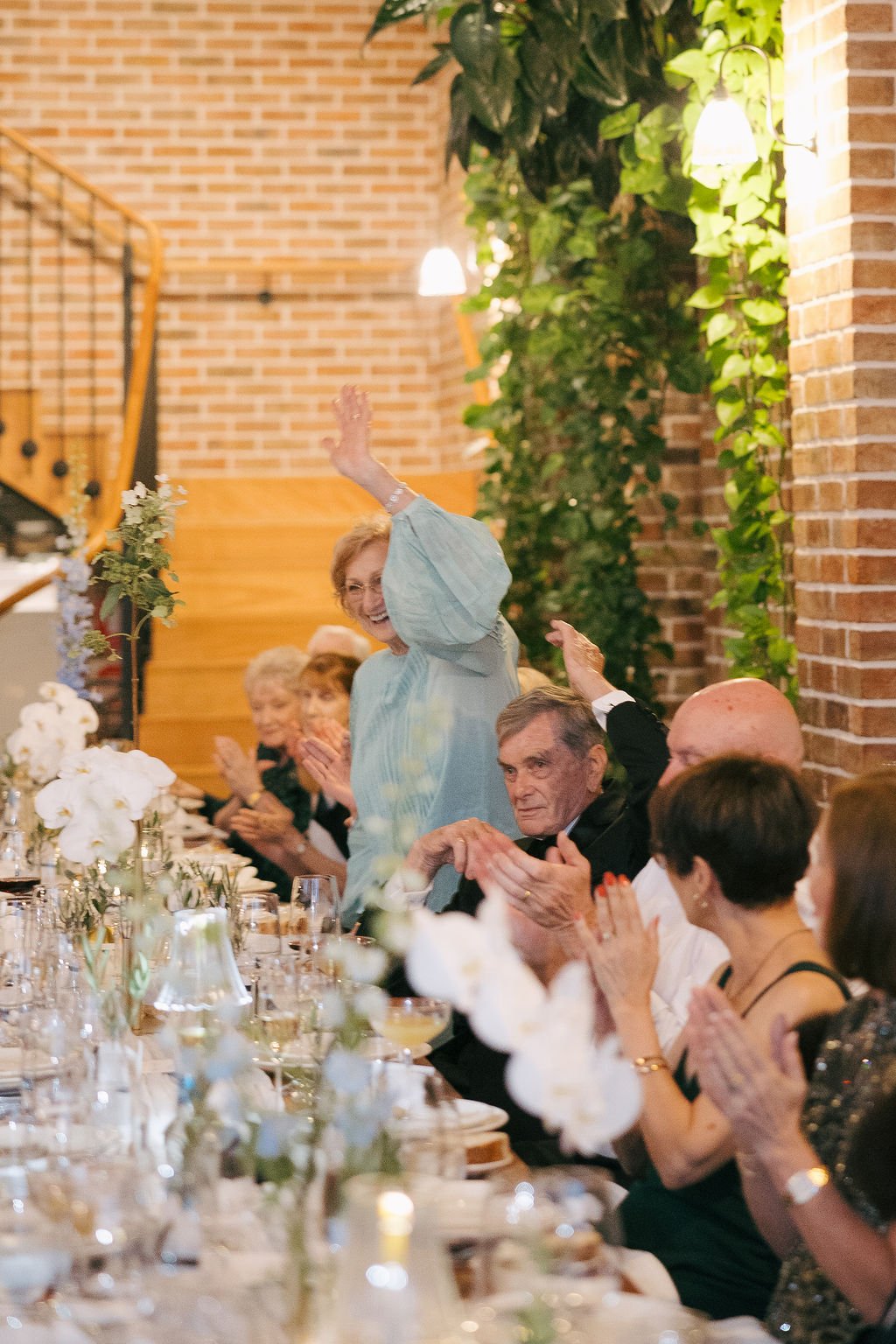 Grandmother cheering at the groom speech 