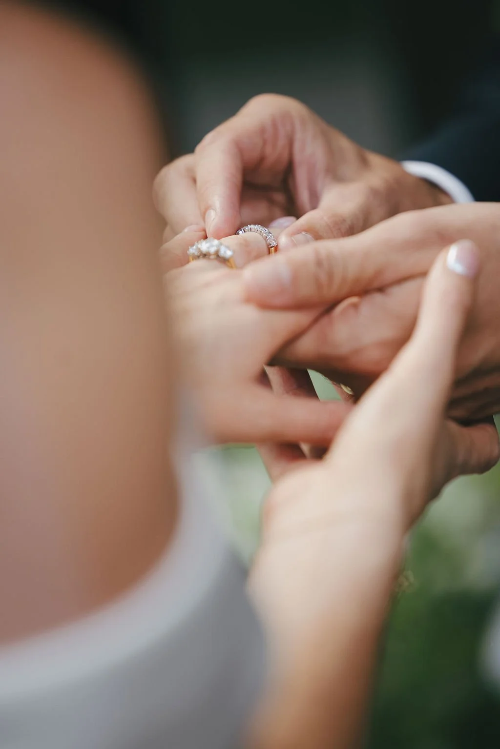 Close-up of the bride and groom exchanging the rings