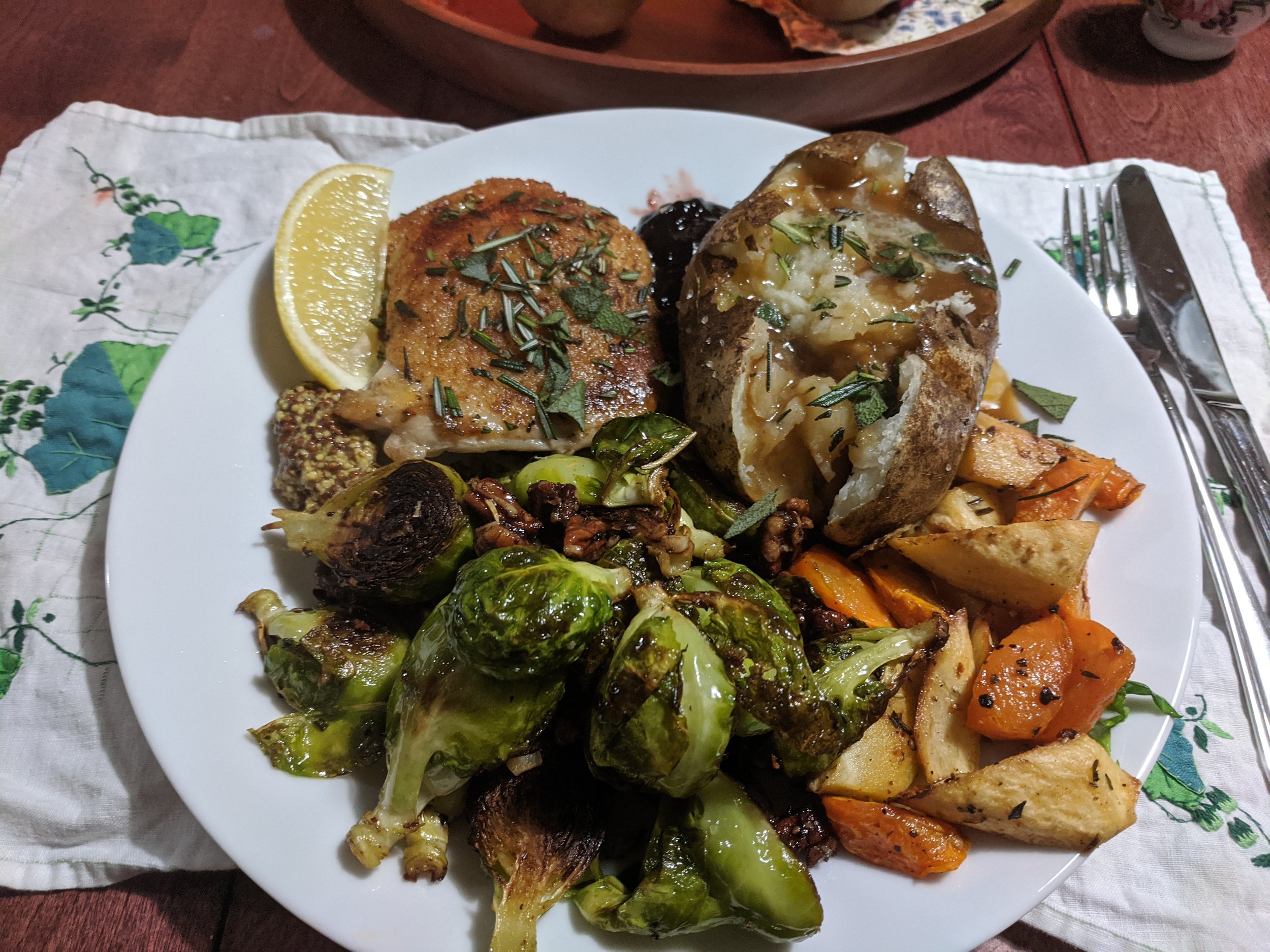 Herb-Brined Chicken Thigh with Pan-Seared Brussels Sprouts, Roasted Autumn Veggies, and Baked Potato