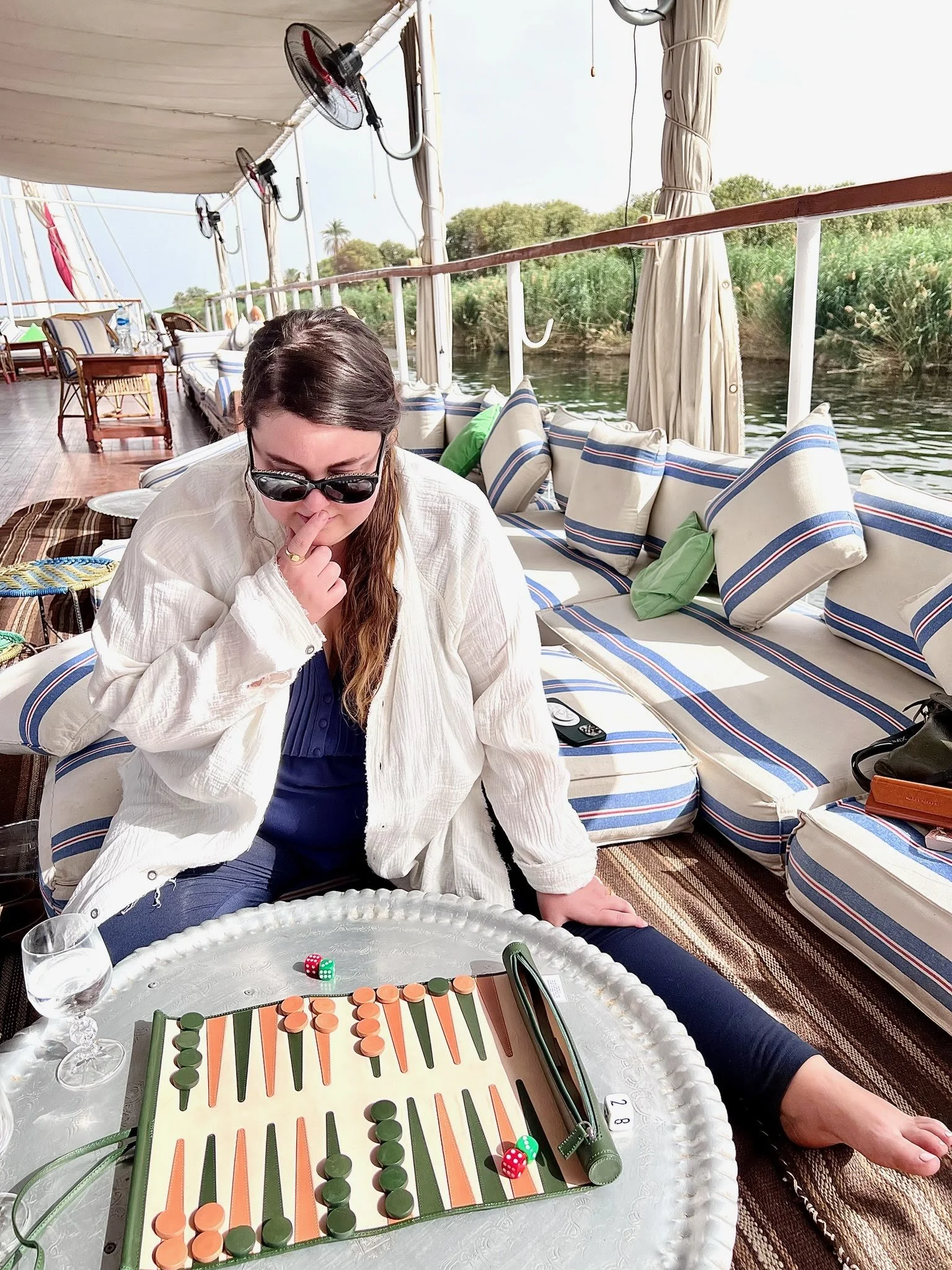 Hannah Wernecke playing backgammon on the Nile River in Egypt on a dahabiyeh