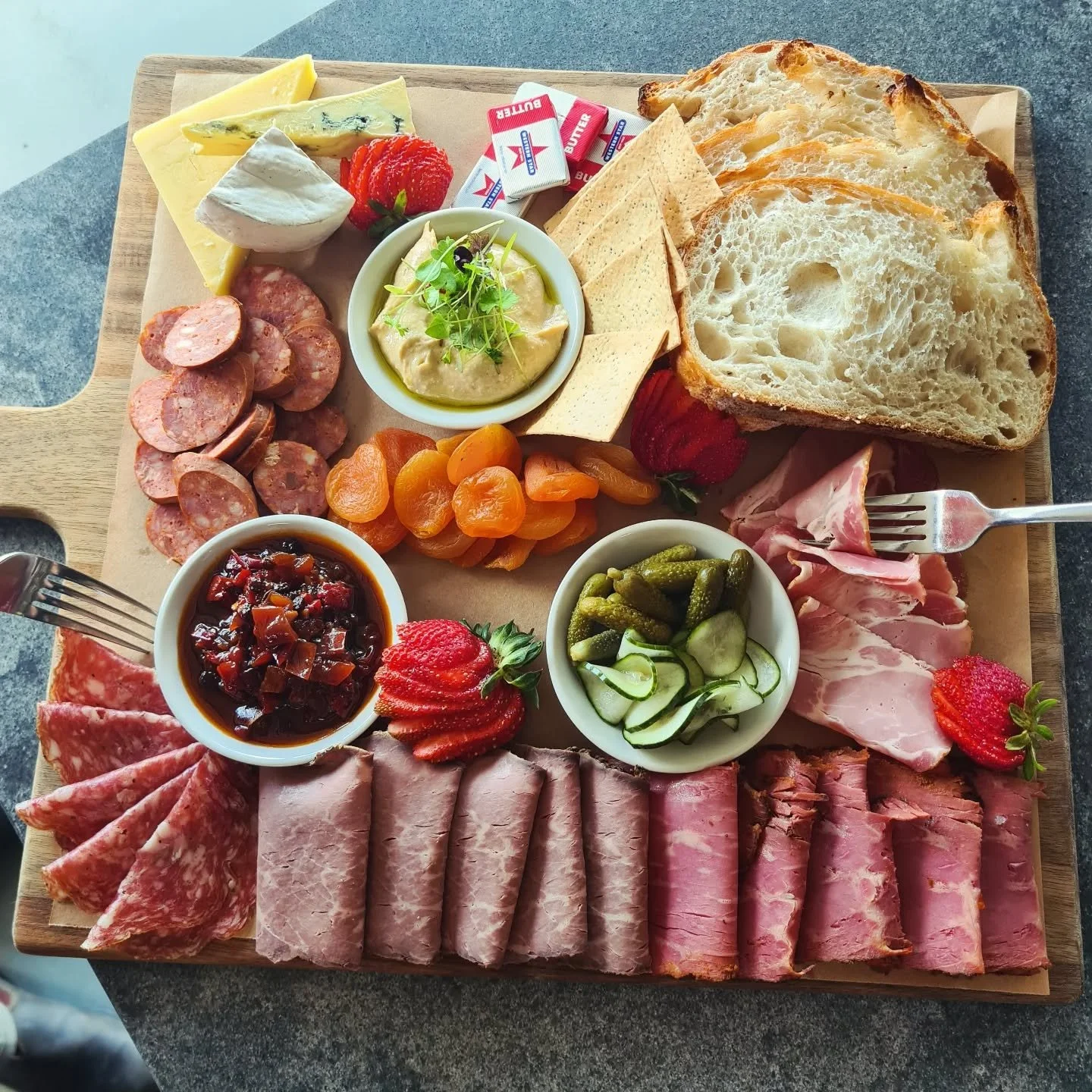 Bond with a friend over our delicious charcuterie board, full of deli-cured meats, mixed cheeses, accoutrements, house-made bread, and crackers!

#theartisanfarmernabiac #nabiac #barringtoncoast #midnorthcoastnsw #charcuterie