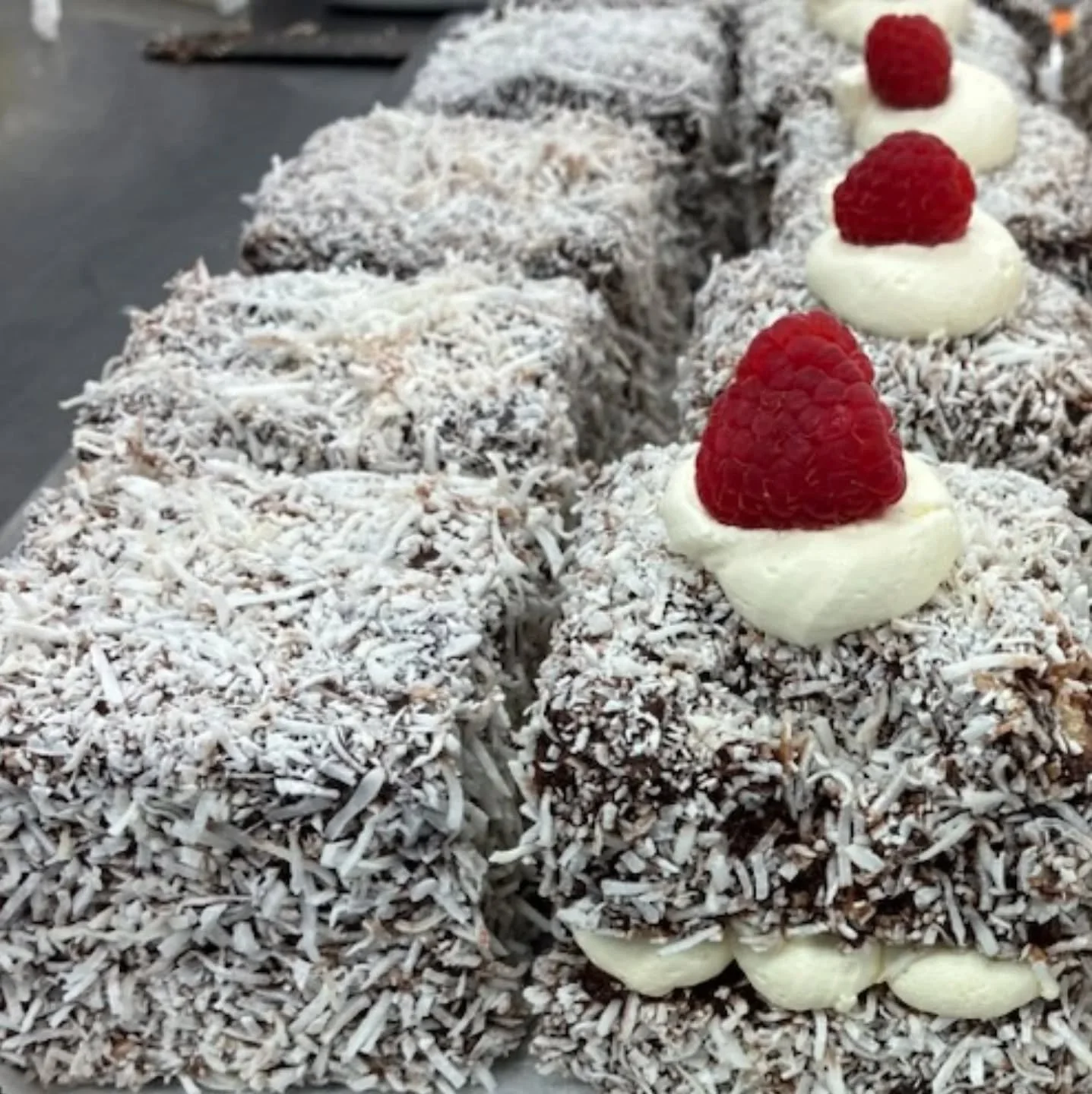 The Kiwis might try to claim it as theirs, but the popular lamington originated in Queensland in Governor Lord Lamington's household: vanilla sponge, chocolate &amp; coconut (plus a few simple variations) - they're always going to good! Grab one toda
