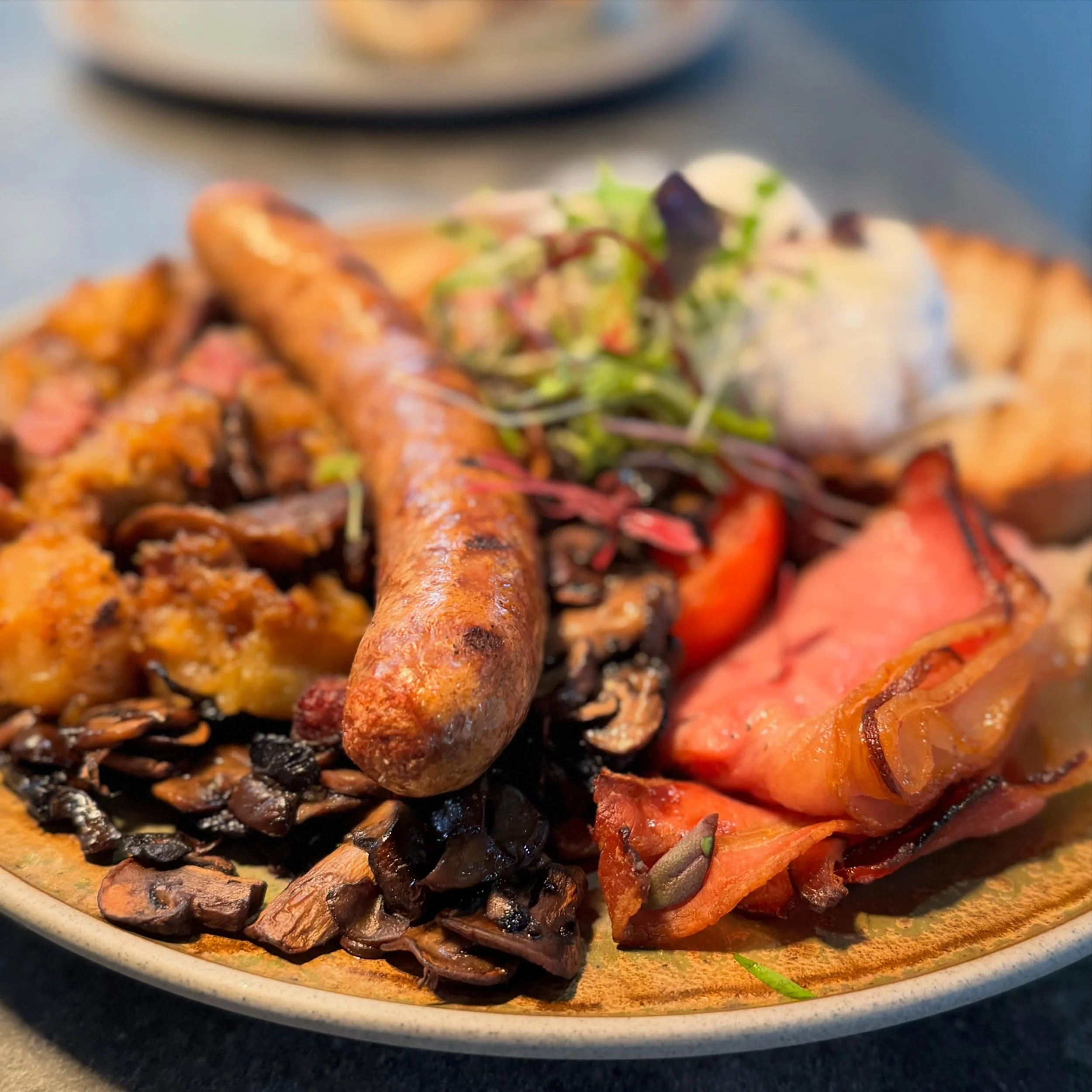 Someone&rsquo;s Sunday morning kicks off with a big breaky. Setting them up for the day are two free-range eggs, our own Wagyu sausage, house-cured bacon, Wagyu pastrami hash, roast tomato, sauteed mushrooms, &amp; house-made baked beans served on ou