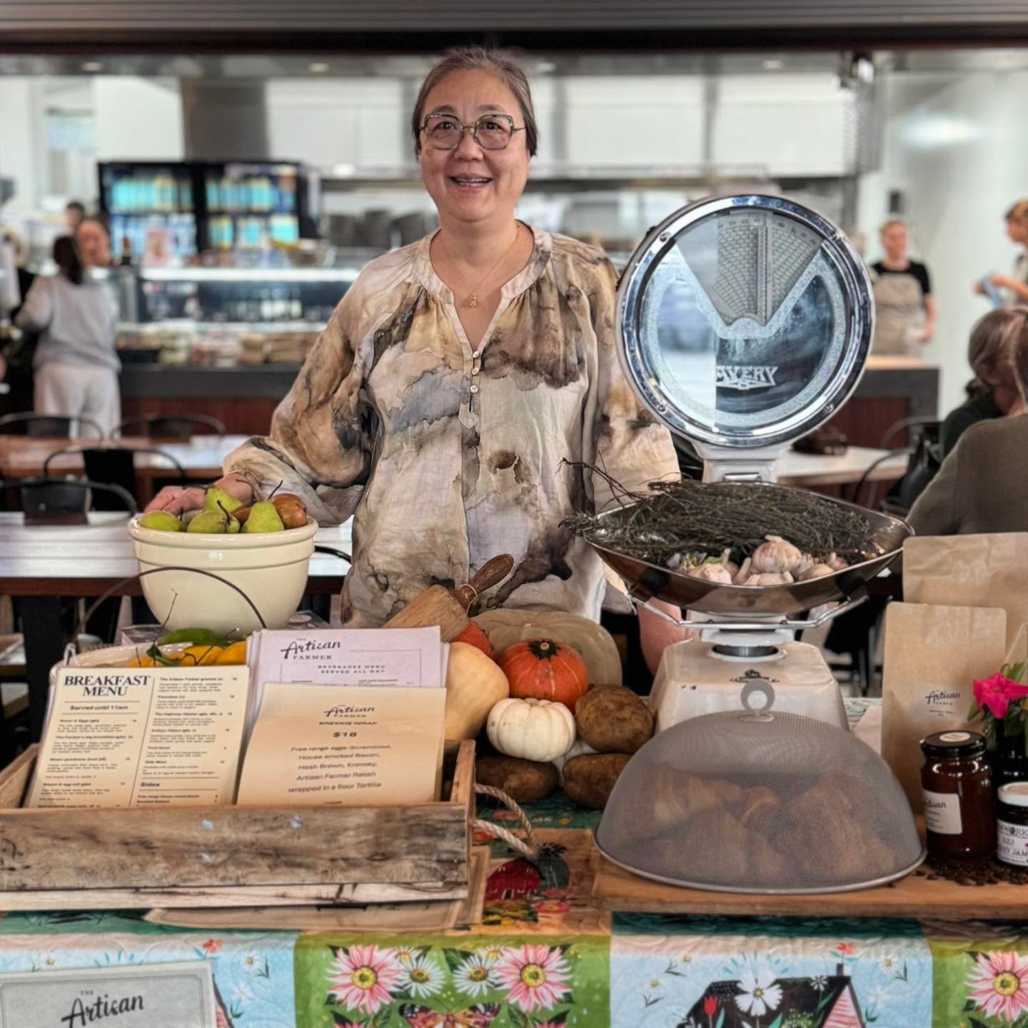 Walk into The Artisan Farmer and you&rsquo;ll find a table near the entrance, with menus and an assortment of merch sitting on a backdrop that can only be described as a masterpiece of textile art. Sally and her small team from Patchwork Nabiac colla