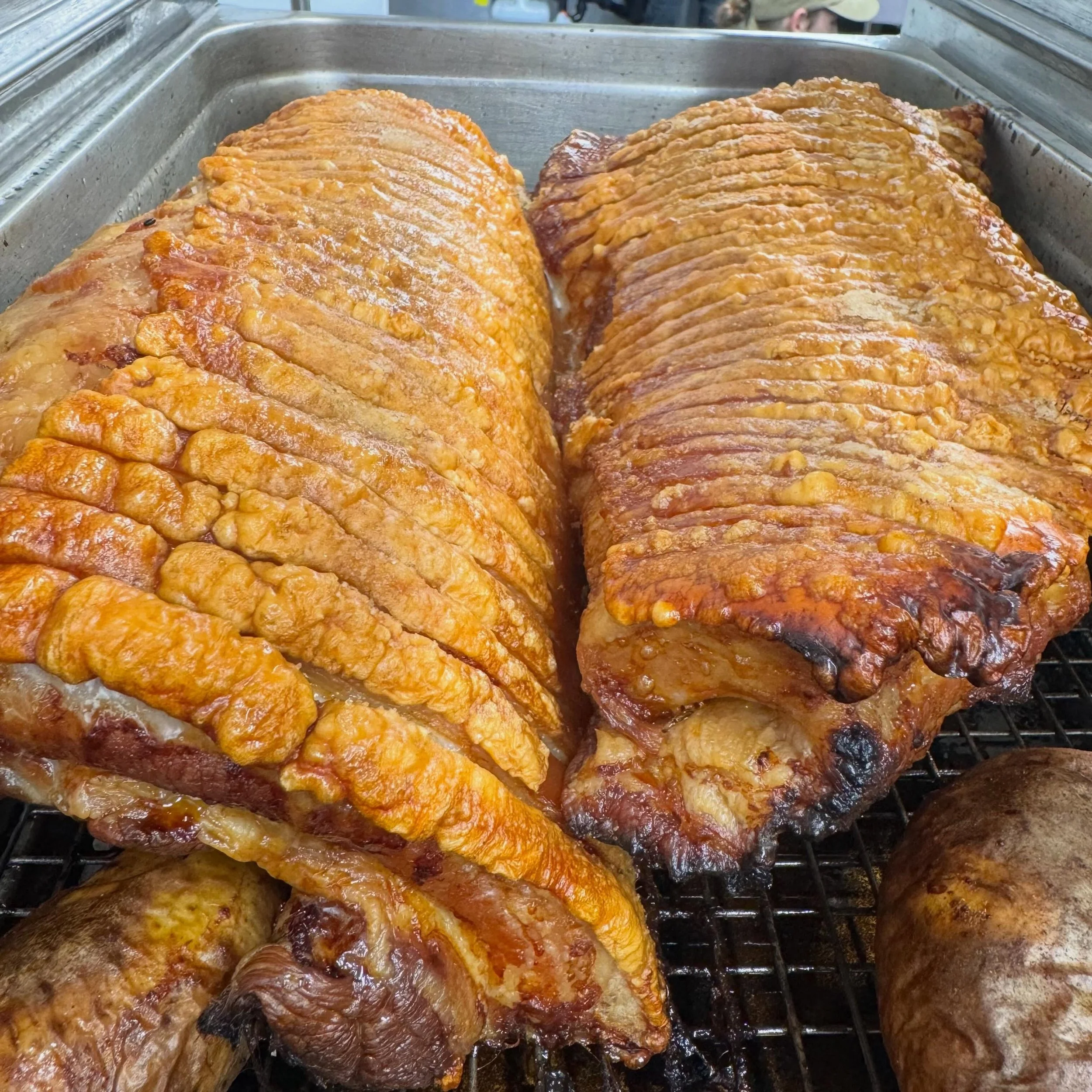 One of the many secrets to great pork crackling is salting the skin to draw out all the moisture and then drying it out overnight. Our chefs have then used potatoes to boost up and even out the surface of this pork from underneath, ensuring the moist