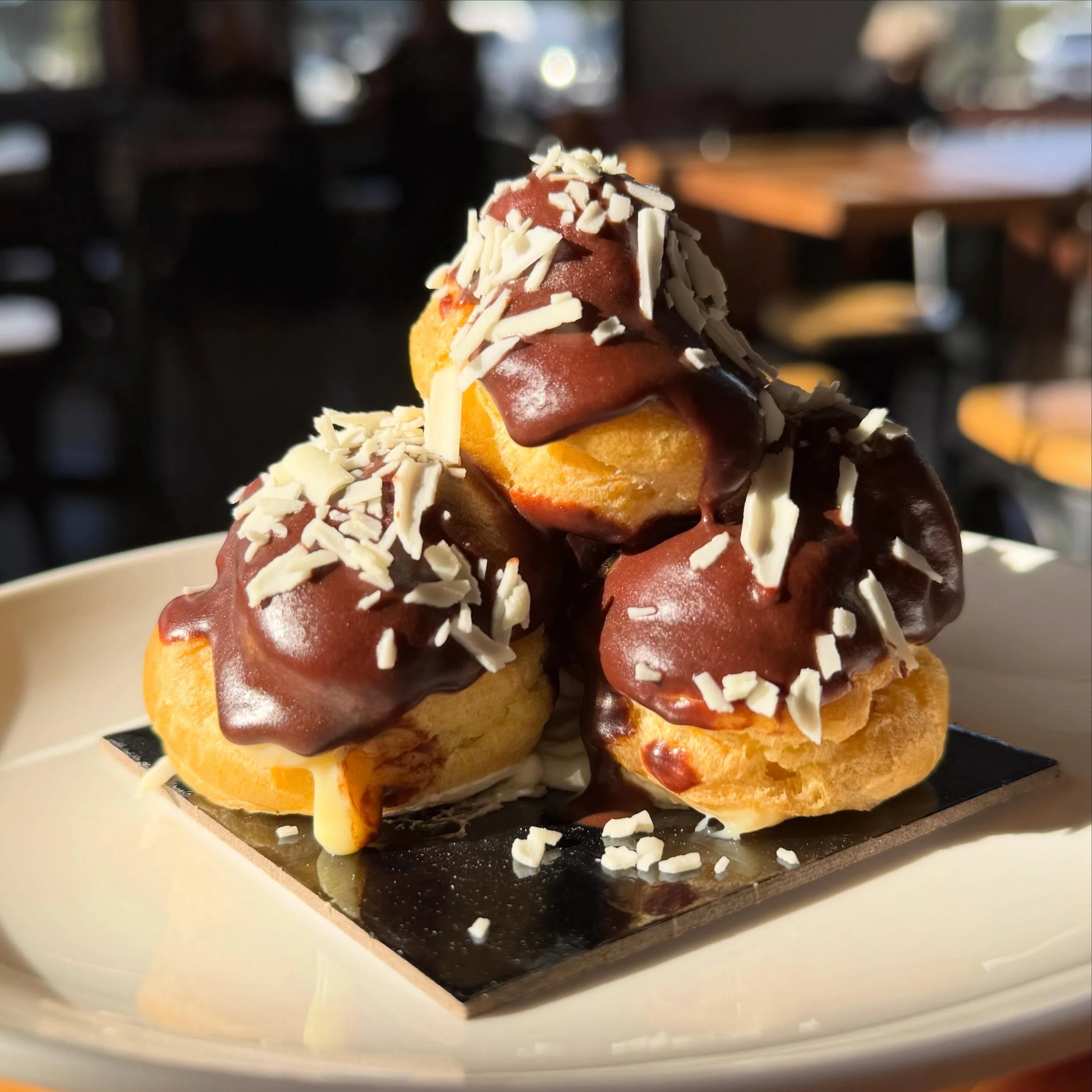 Check out these scrumptious, delicate profiteroles from our bakery, their airy hollows filled with a light, tasty vanilla custard!

Etymology translates profiteroles as &lsquo;small profit&rsquo; from French. They have evolved over several hundred ye