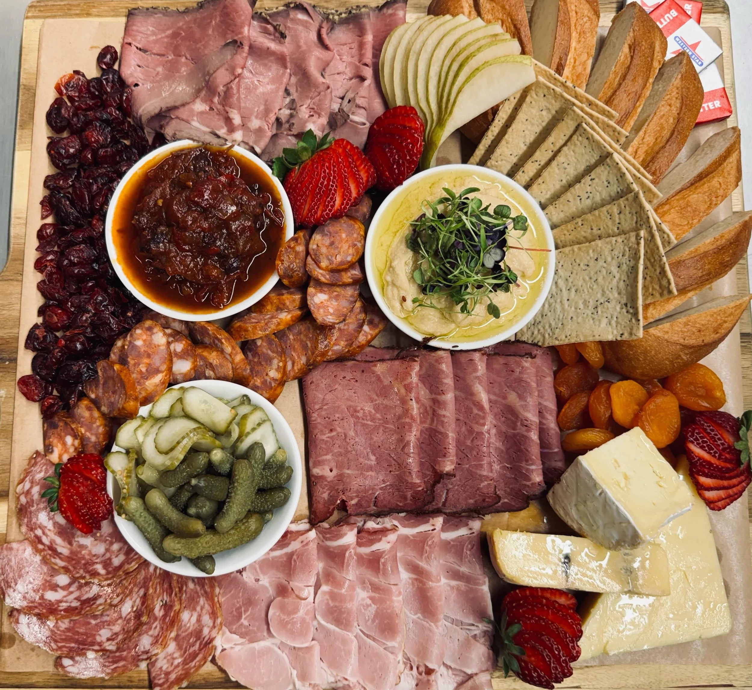 There&rsquo;s something to be said for the art of presentation! This is our charcuterie board, full of treasures from our deli and shop. If you didn&rsquo;t think to order one before, maybe this will help! Just make sure you bring one or two friends 