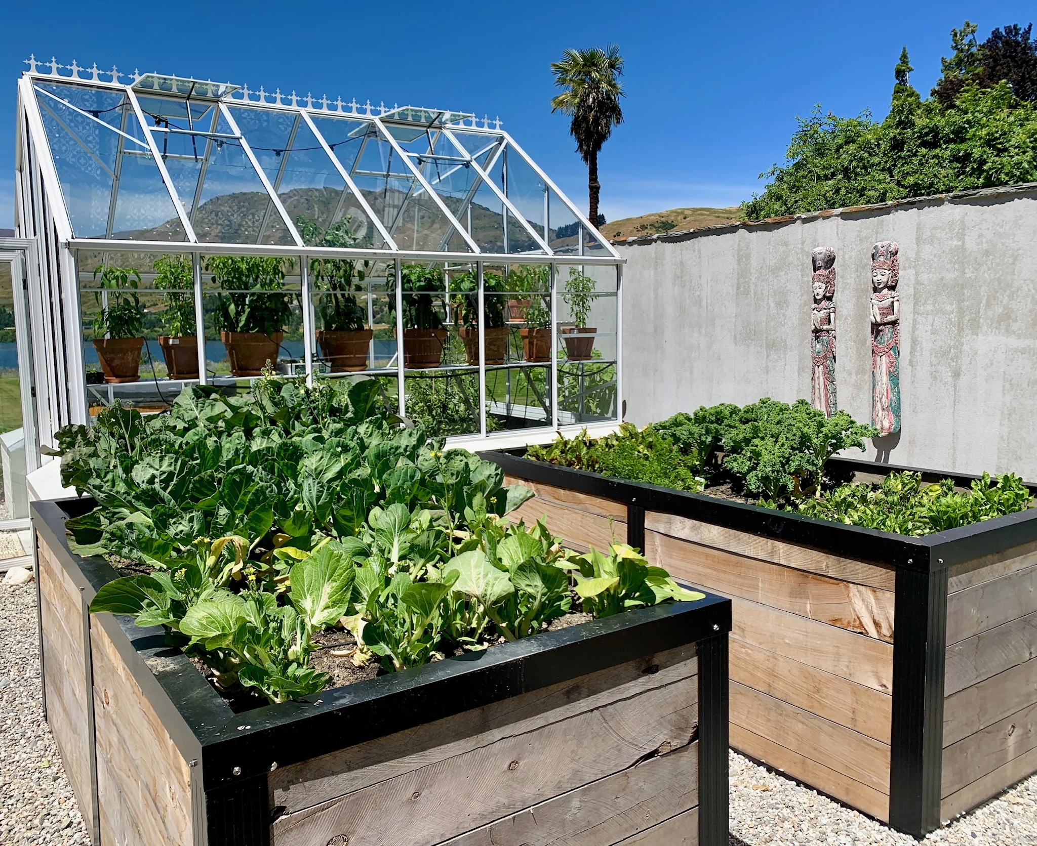 Behind the schist wall of the pool is the organic vegetable garden that guests are welcome to help themselves to. 