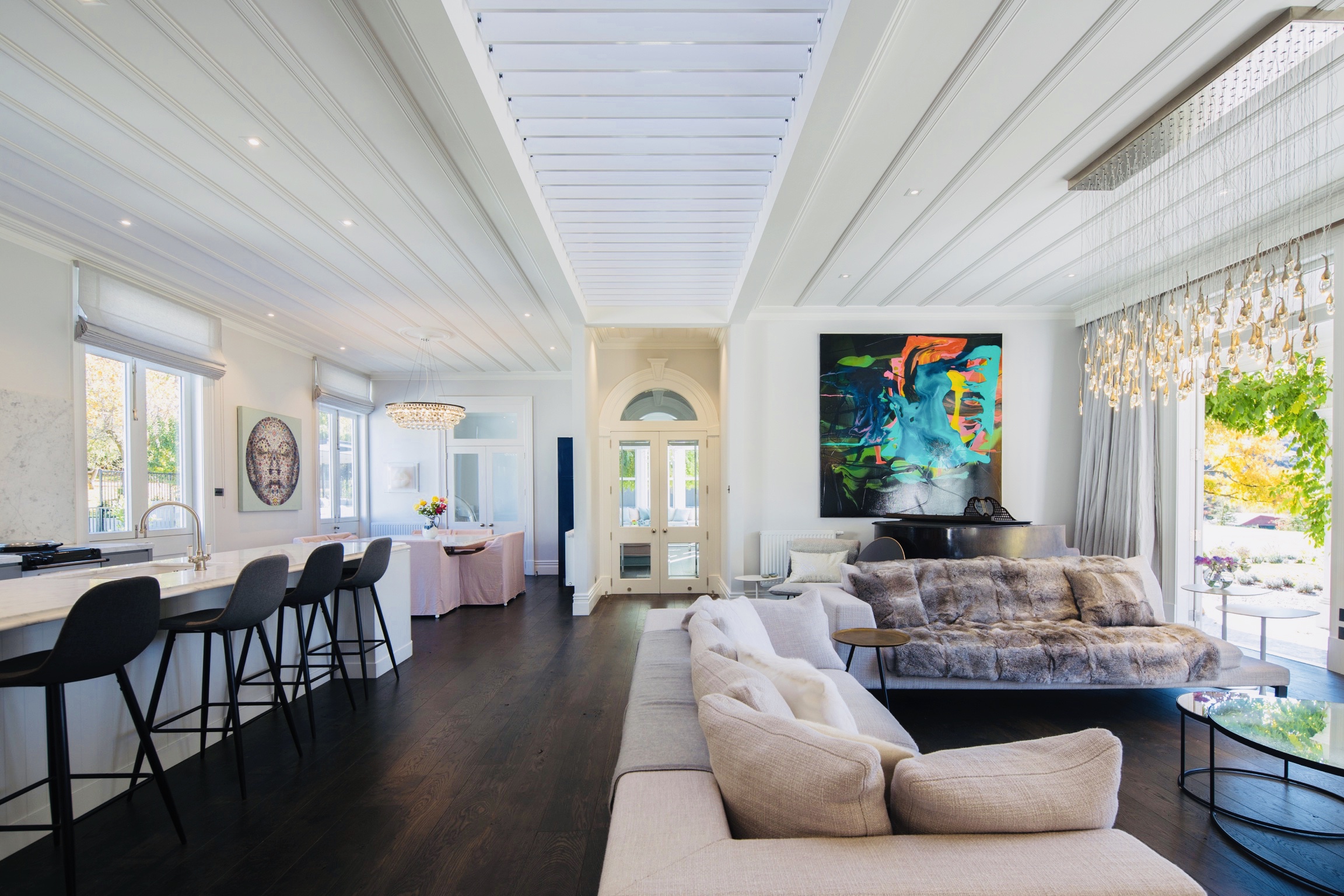 The Great Room is flooded with light through the large skylight above