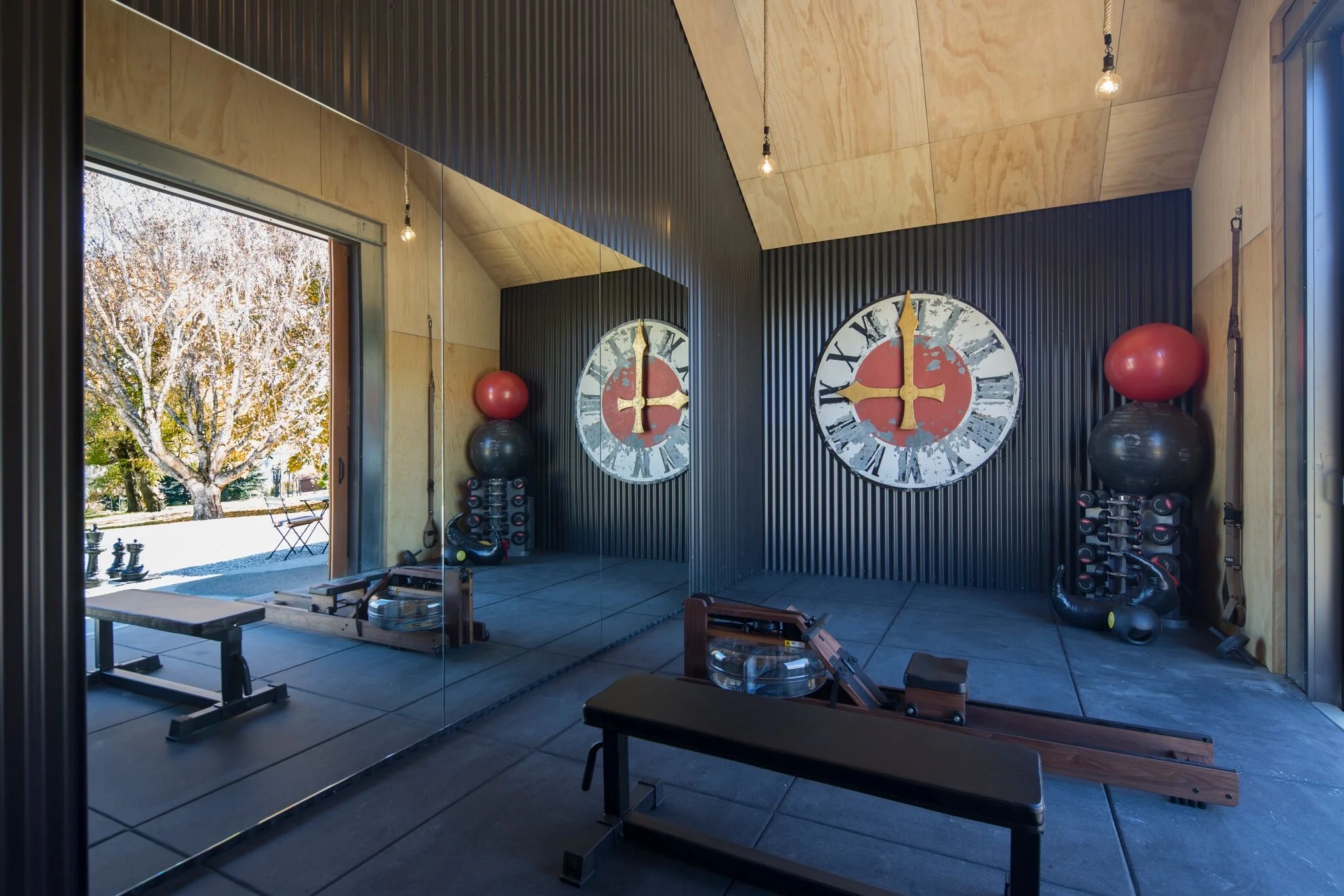 Gym equipment includes a WaterRower rowing machine, a full set of weights, bench and fit balls.