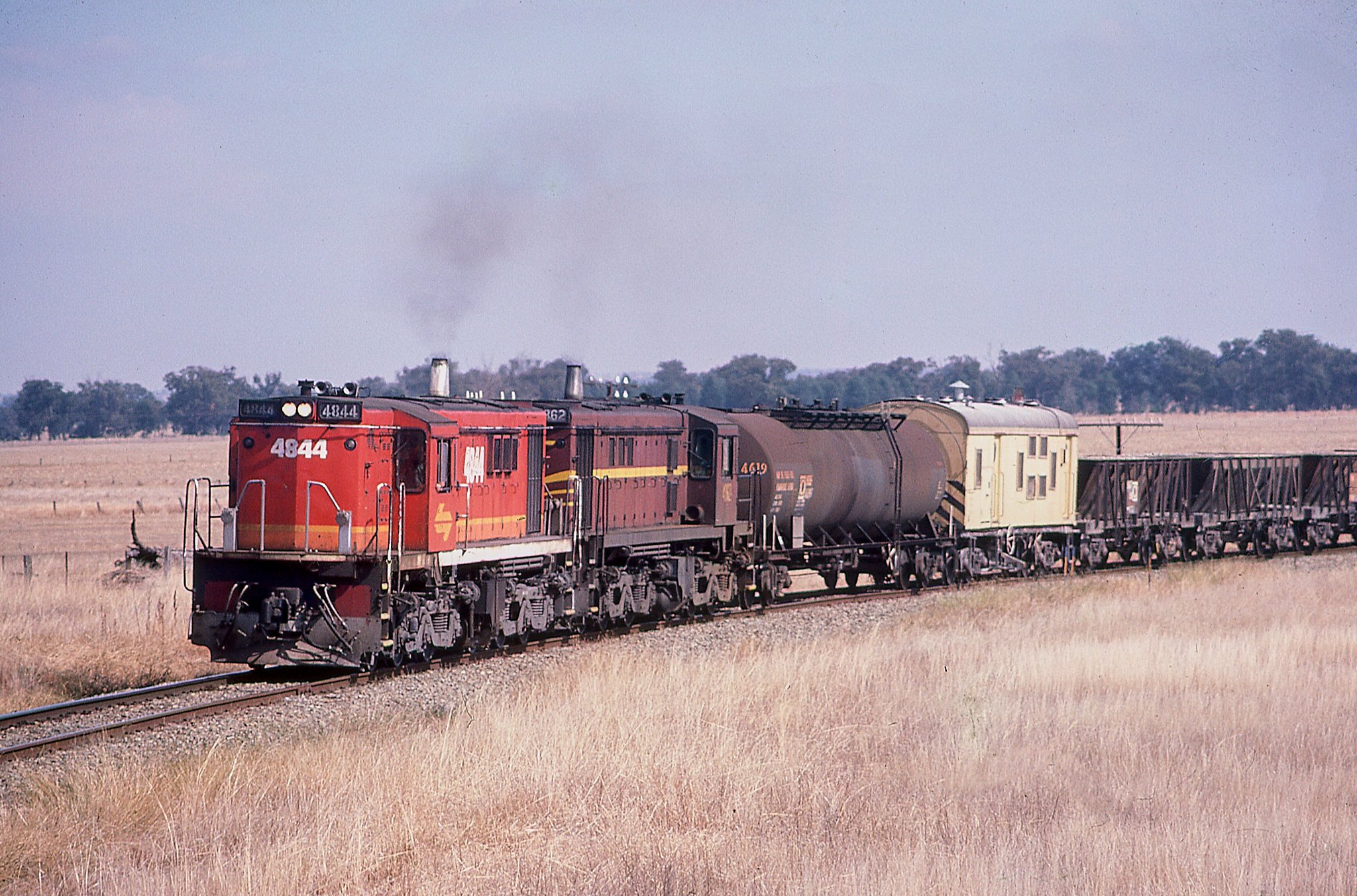 4844+4862 ballast train Stockinbingal. April 1987