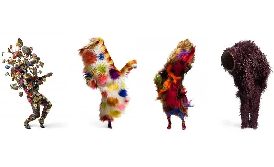 Four sculptural Soundsuits by Nick Cave made from brightly coloured fur, beads, and found materials, each fully concealing the wearer’s body.