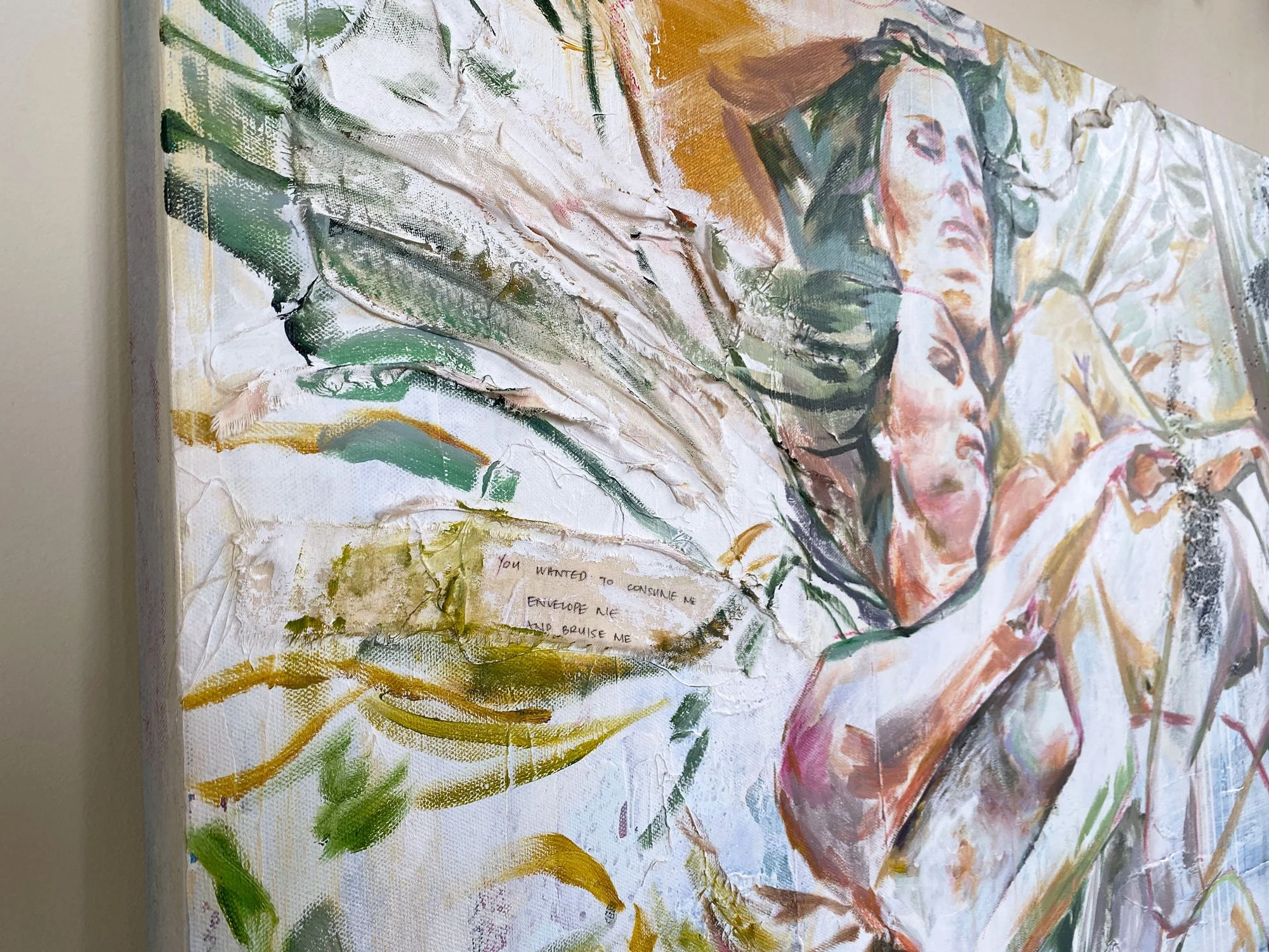 Close-up angle detail showing handwritten text on fabric and paint in Where We Overlap by Cristina Rago