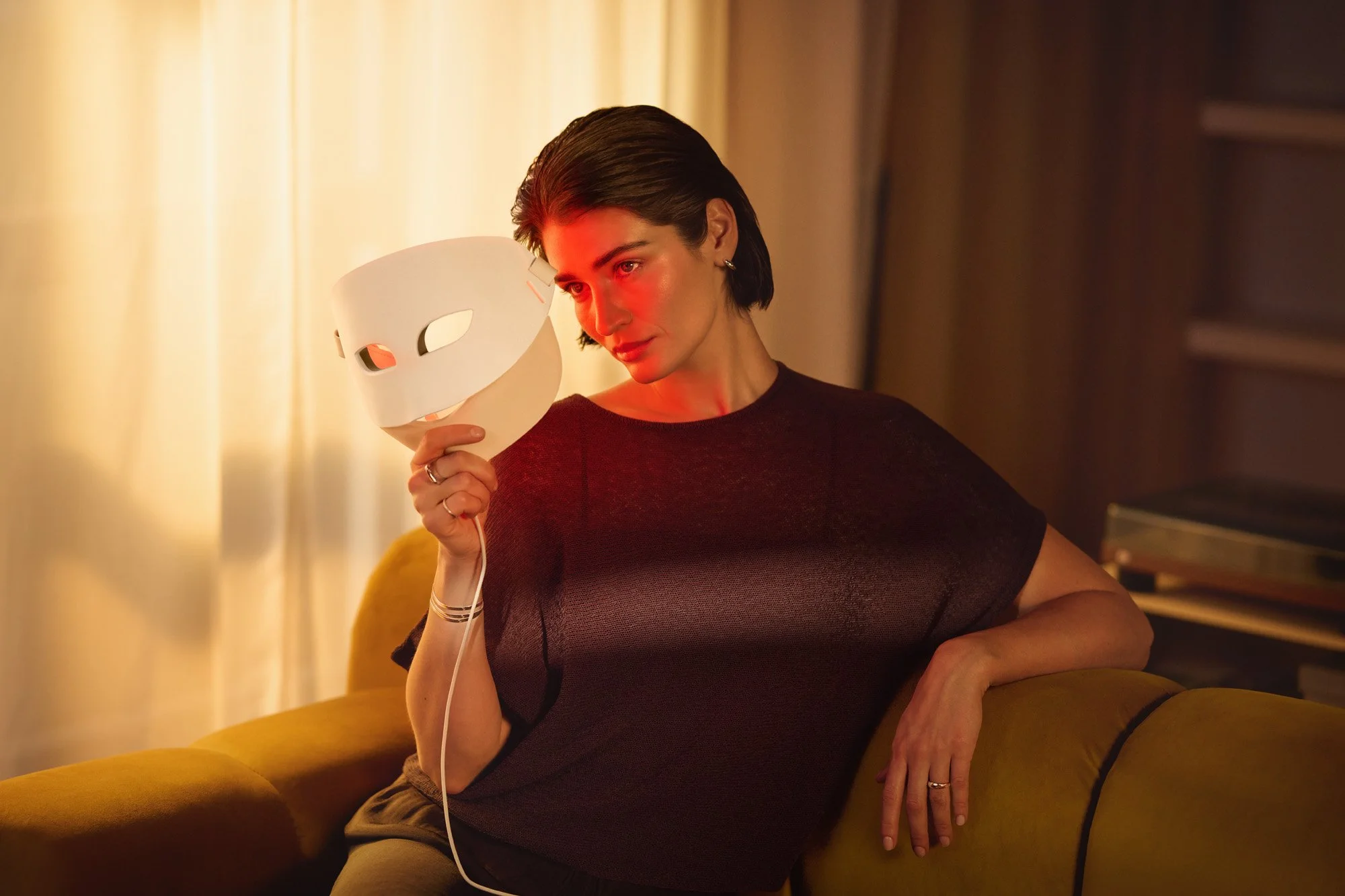 Philips Personal Care | a beauty shot of a woman utalizing ReAURA LED mask