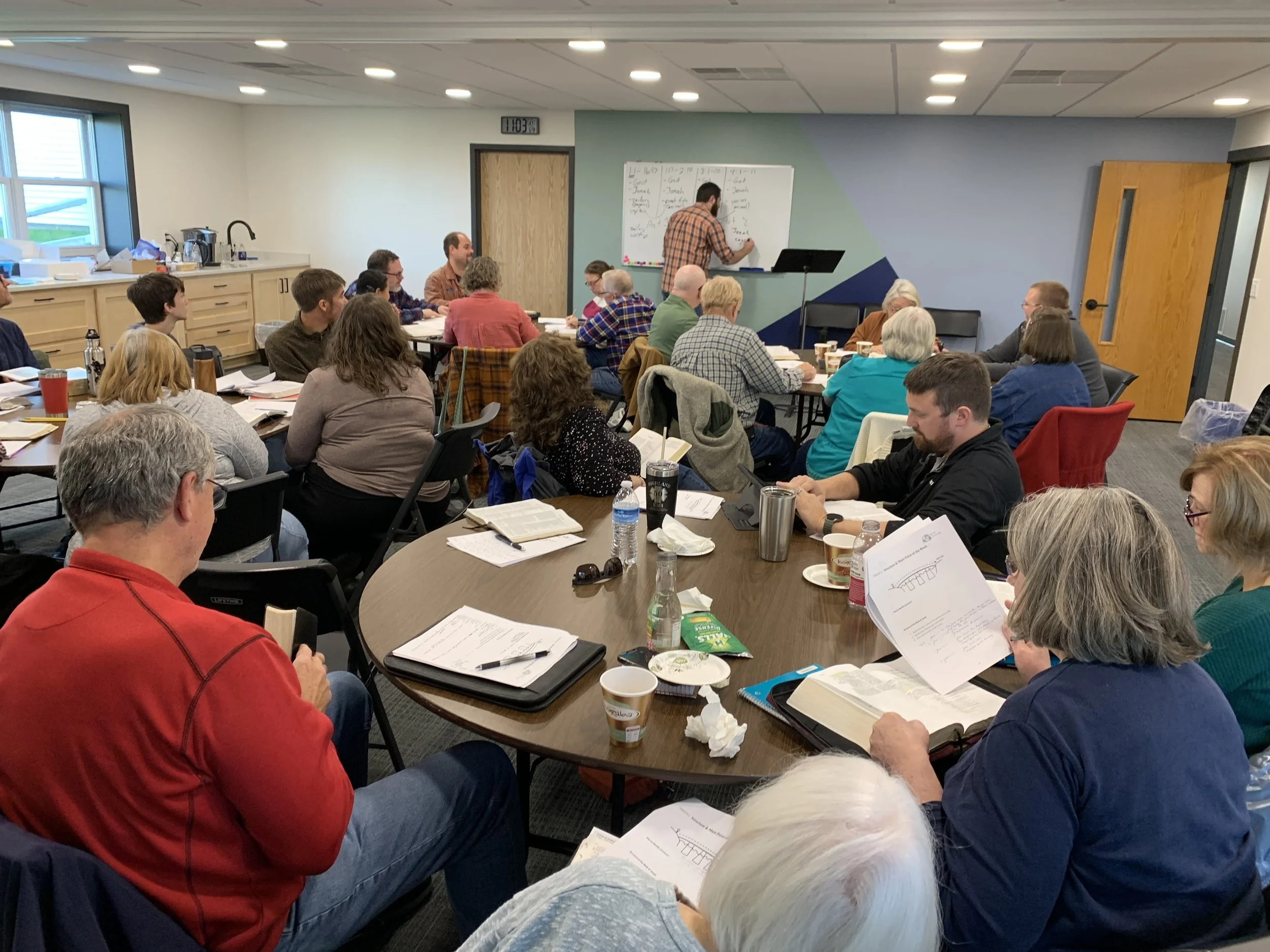 A diverse group of people learning how to study the Bible and scripture in a workshop setting with Michael McKittrick