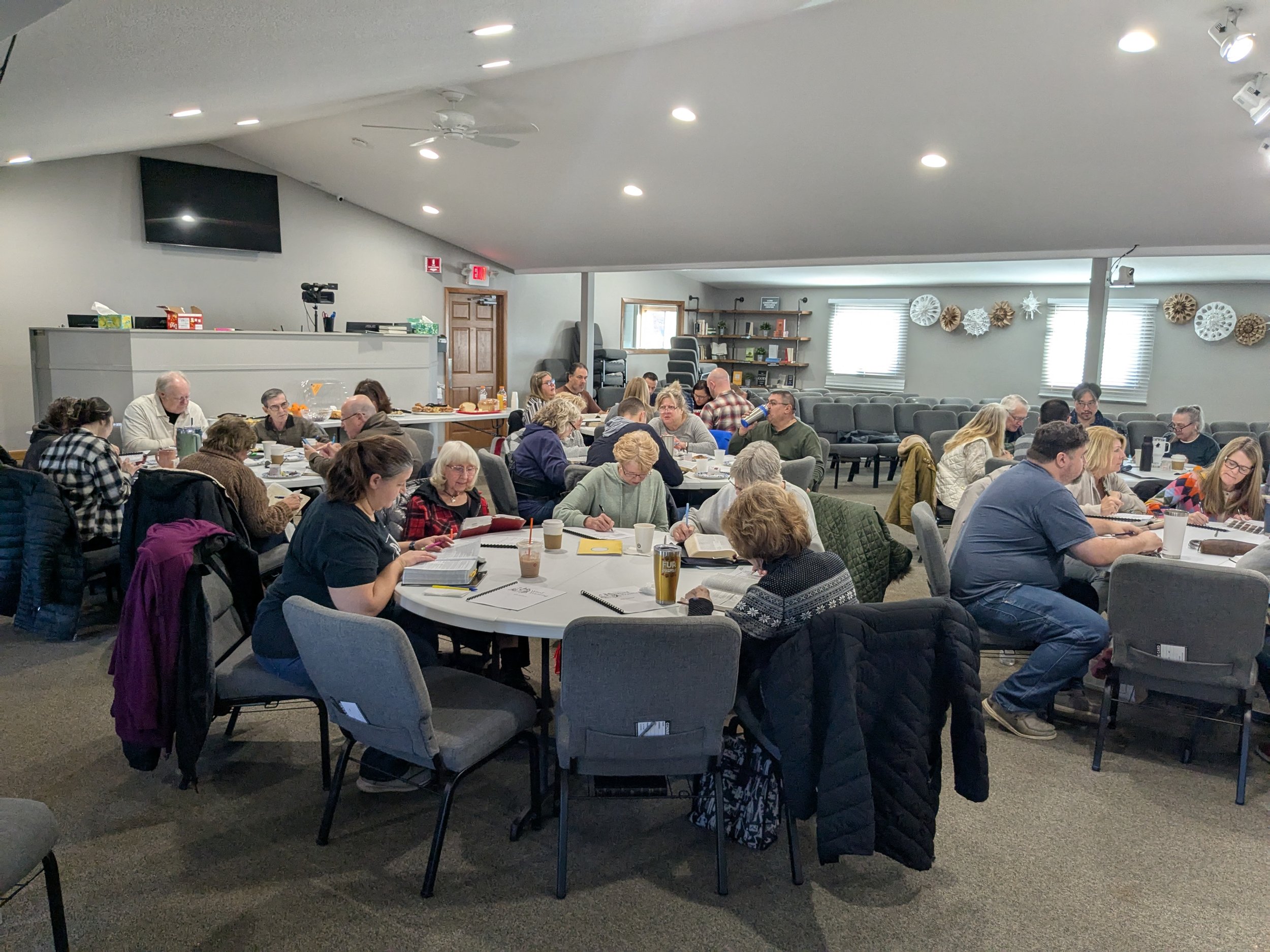 A diverse group of people learning how to study the Bible and scripture in a Word Training workshop setting with Michael McKittrick