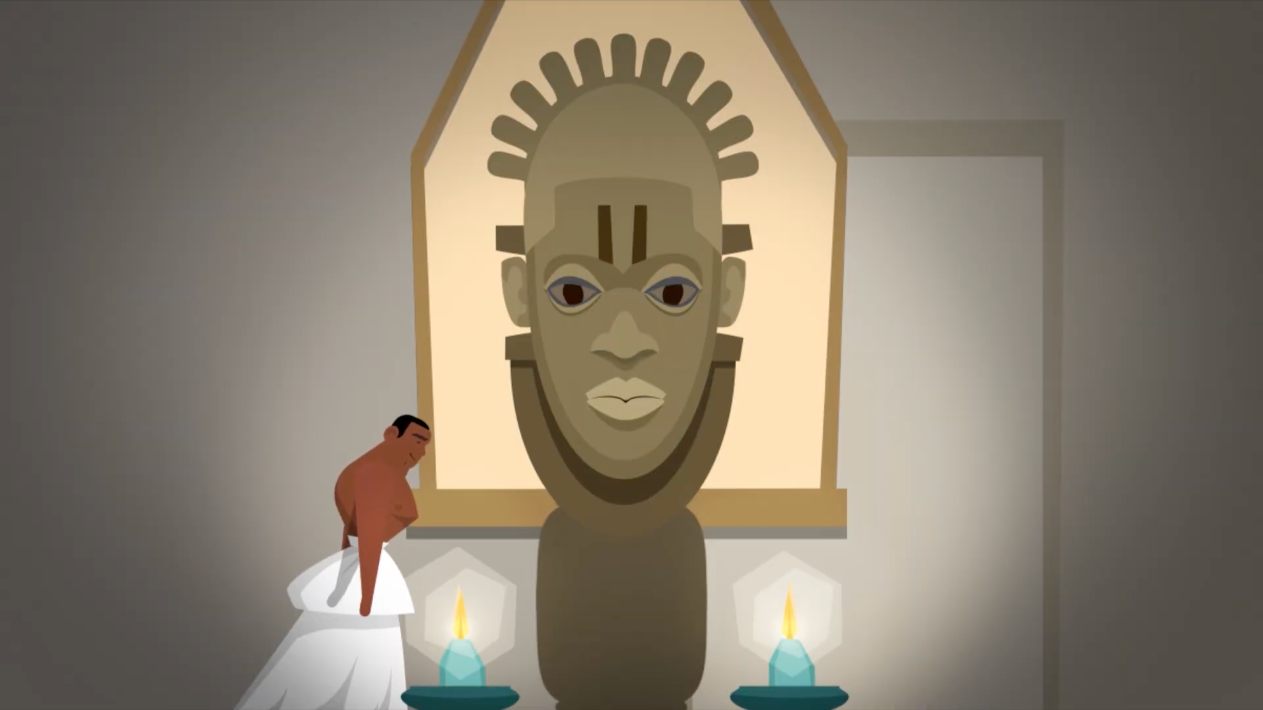 Carved ivory head lit by candles beside the Benin Craftsman, BBC Bitesize film on how the Obas were seen