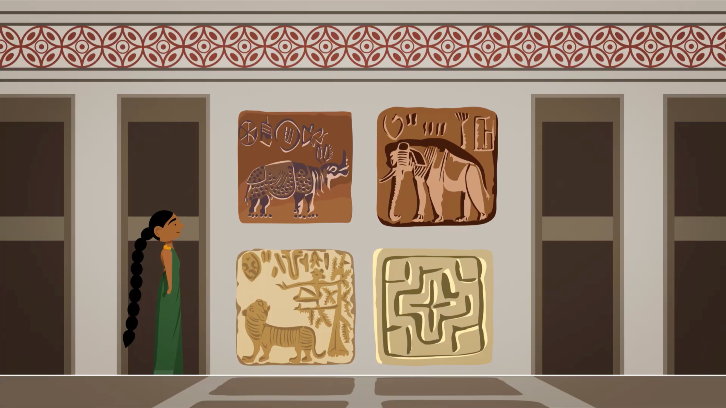 Harappan Girl beside display cases of carved stone animal seals, BBC Bitesize film on Indus Valley life