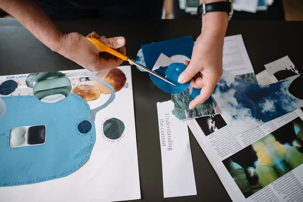 Hands making a collage as part of a creative training session